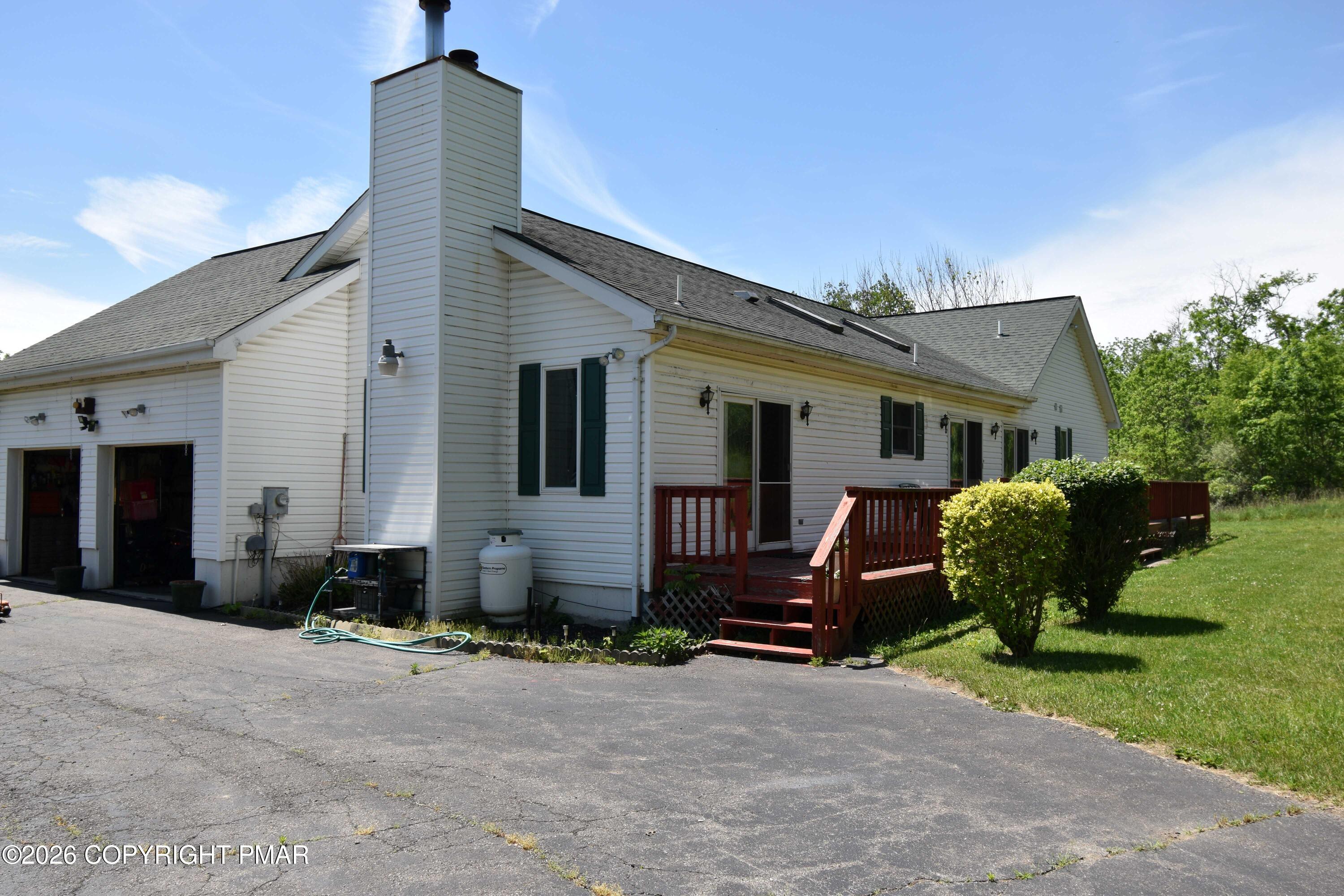 160 Quiet Valley Road Mount Bethel, PA 18343 - Photo 3 of 44 a front view of a house with garden