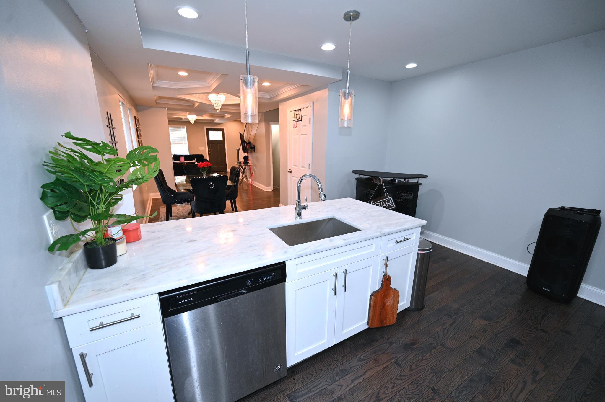 3700 Flowerton Road Baltimore, MD 21229 - Photo 14 of 30 a kitchen with a sink and wooden floor