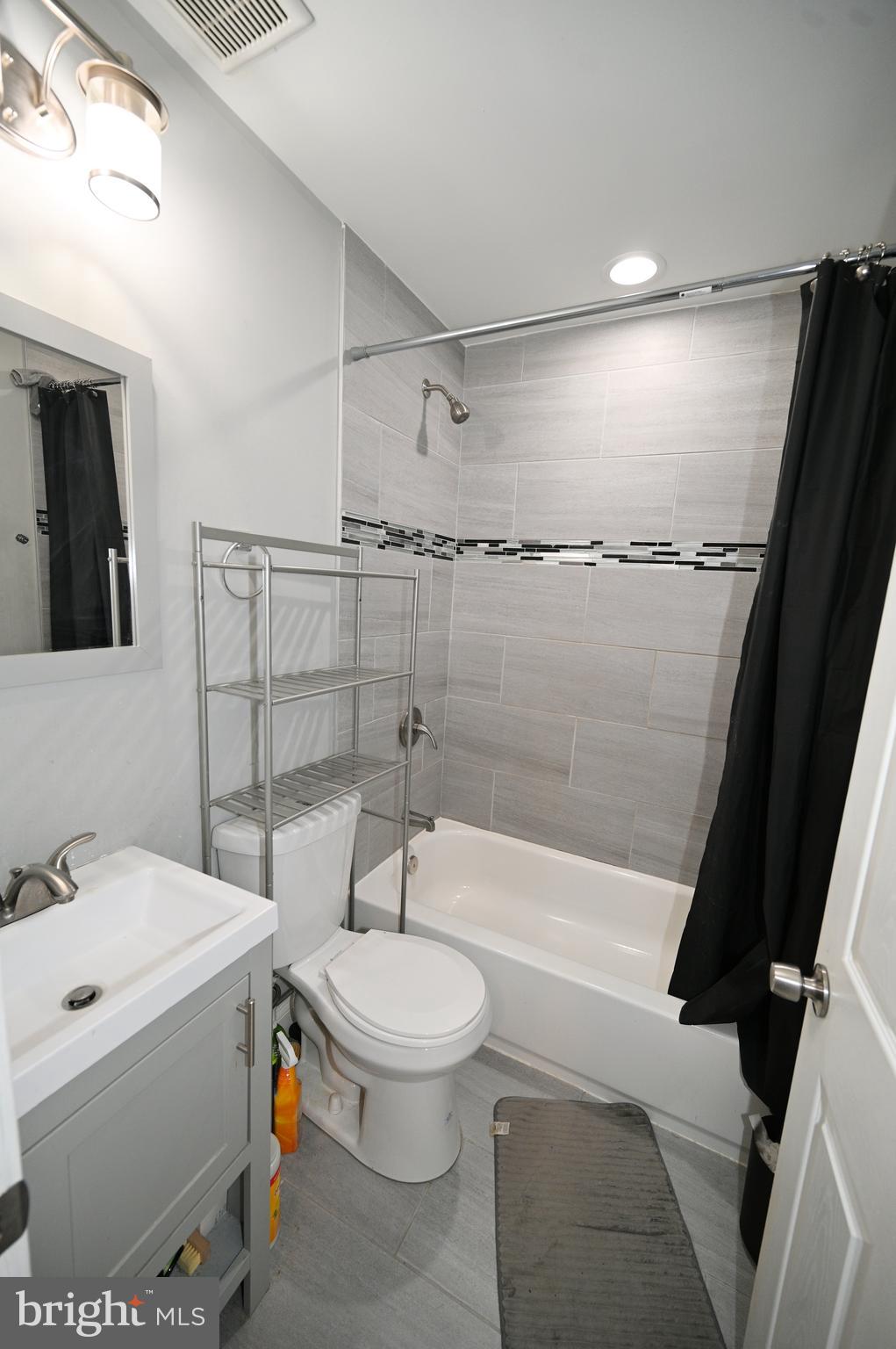 3700 Flowerton Road Baltimore, MD 21229 - Photo 20 of 30 a bathroom with a sink a toilet and shower
