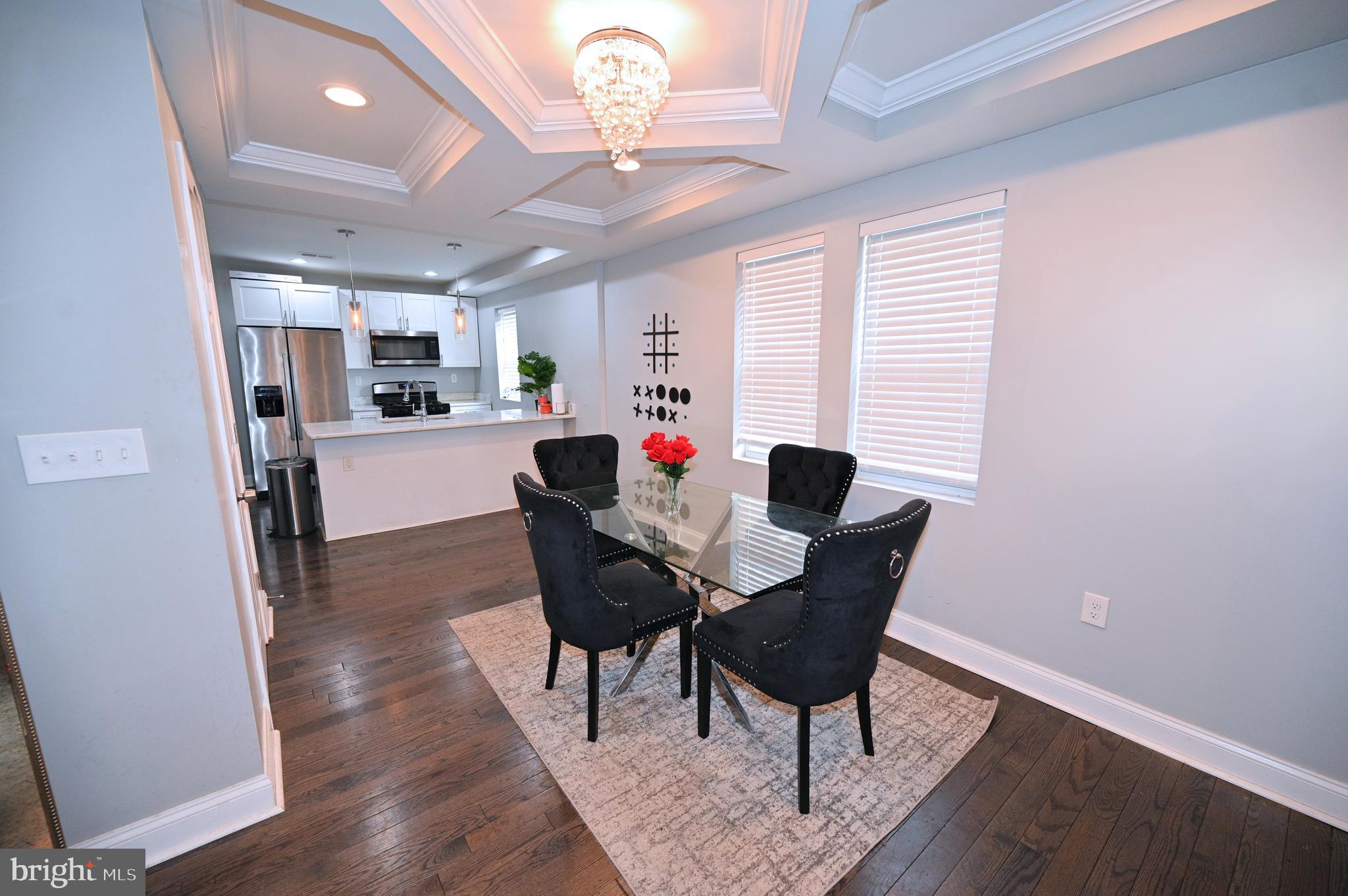 3700 Flowerton Road Baltimore, MD 21229 - Photo 2 of 30 a view of a dining room with furniture window and wooden floor
