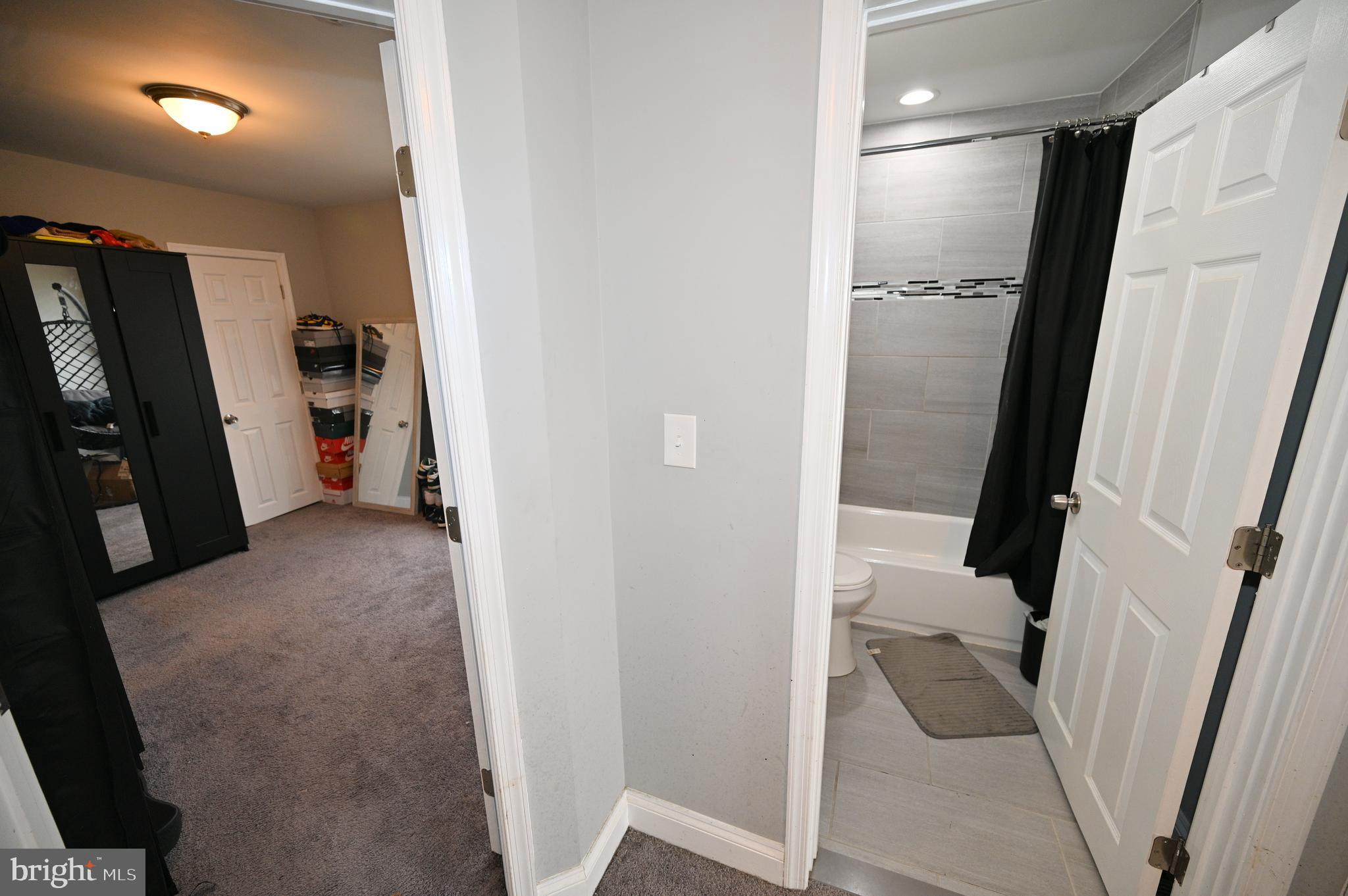 3700 Flowerton Road Baltimore, MD 21229 - Photo 21 of 30 a view of a hallway and a livingroom with furniture