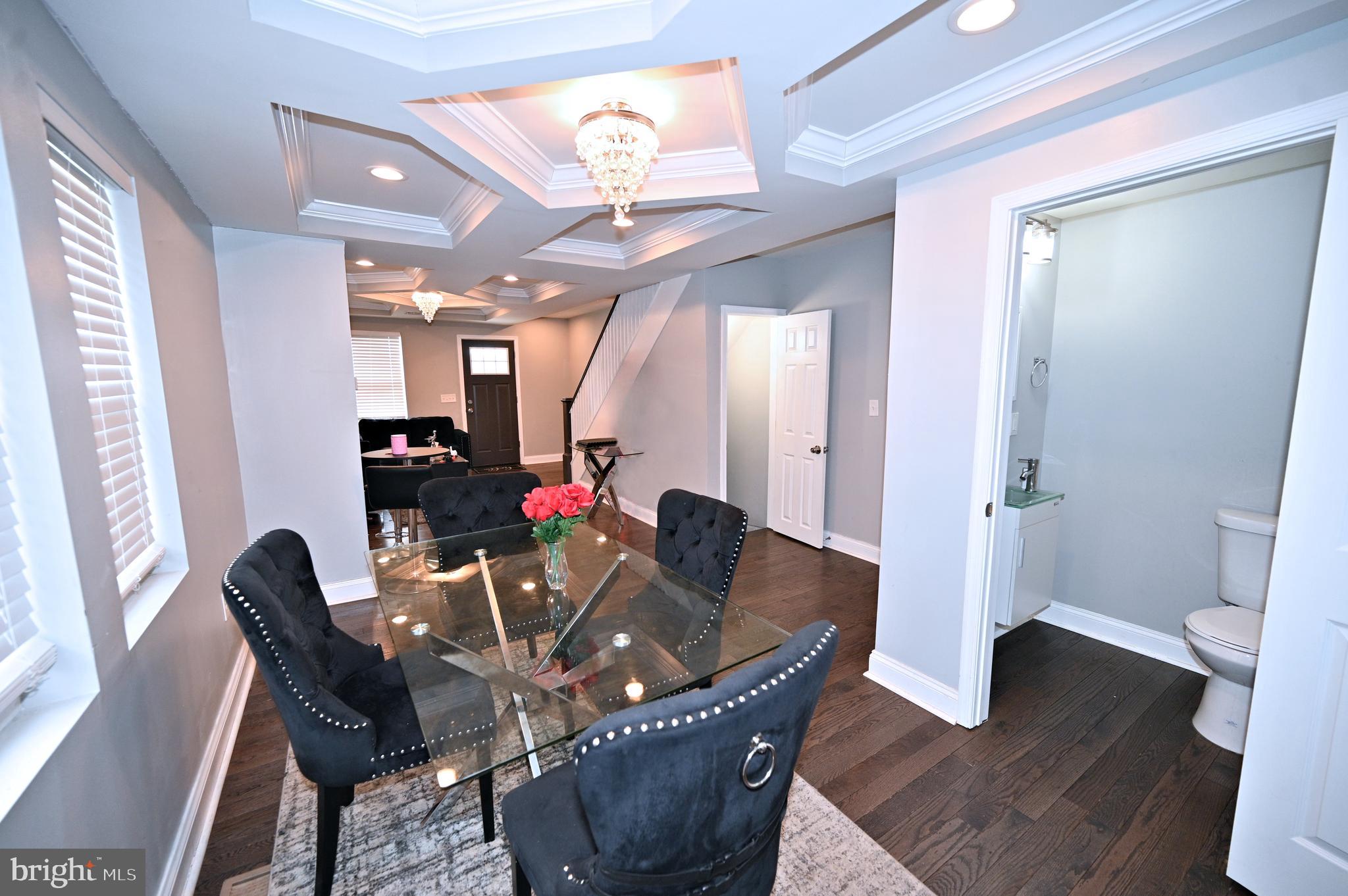 3700 Flowerton Road Baltimore, MD 21229 - Photo 3 of 30 a view of a dining room with furniture and wooden floor