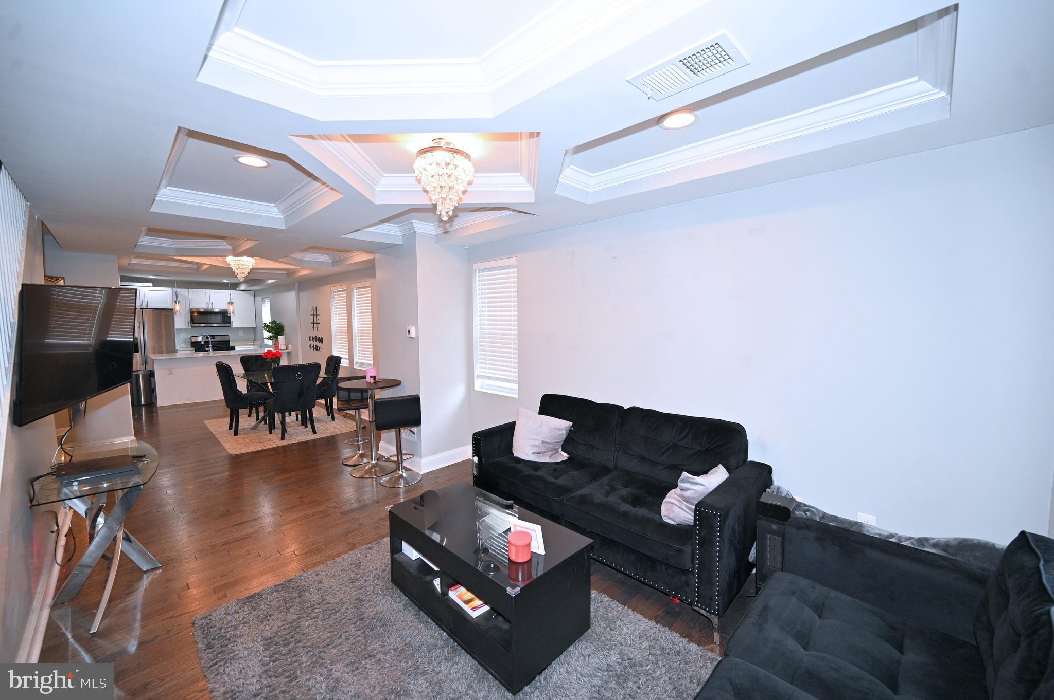 3700 Flowerton Road Baltimore, MD 21229 - Photo 5 of 30 a living room with furniture and a flat screen tv