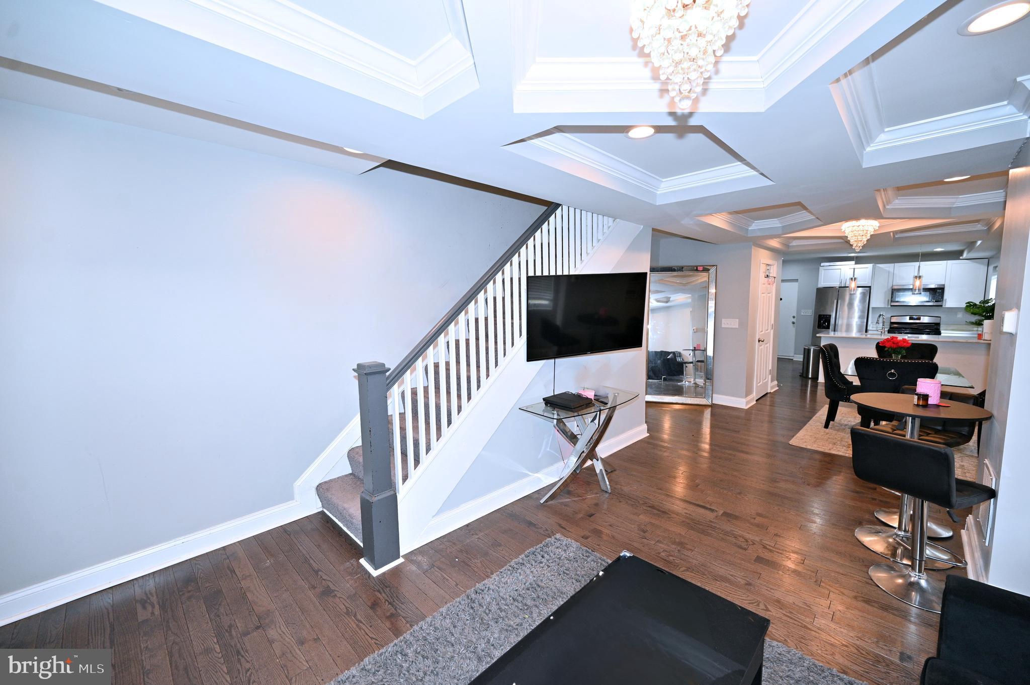 3700 Flowerton Road Baltimore, MD 21229 - Photo 6 of 30 a living room with furniture and a flat screen tv