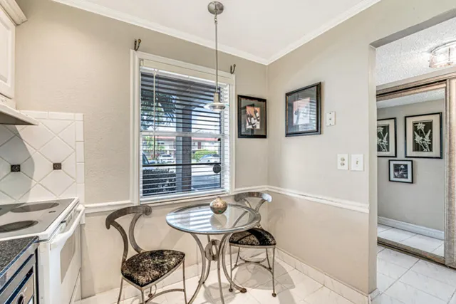 a front view of a building with a garden