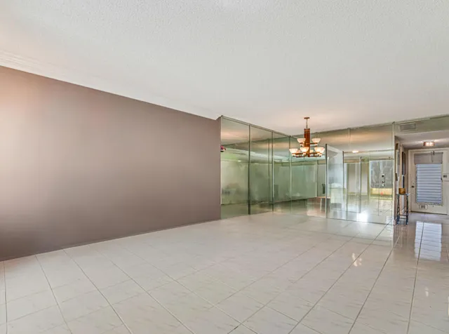 a view of a livingroom with a chandelier fan