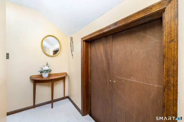 a bedroom with a bed and a chair