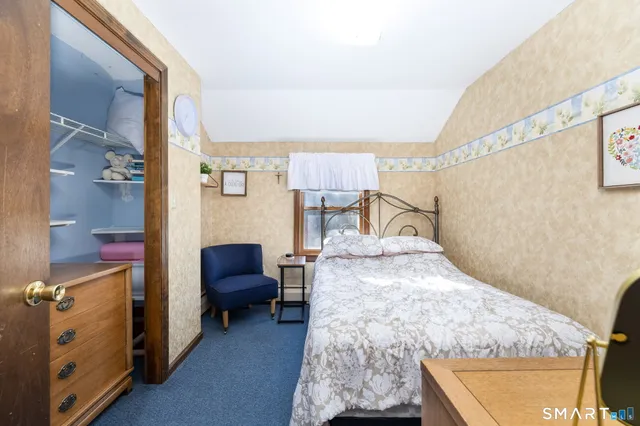 a bathroom with a sink mirror vanity and toilet