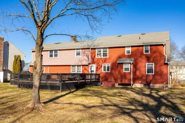 a view of balcony with two chairs and wooden floor