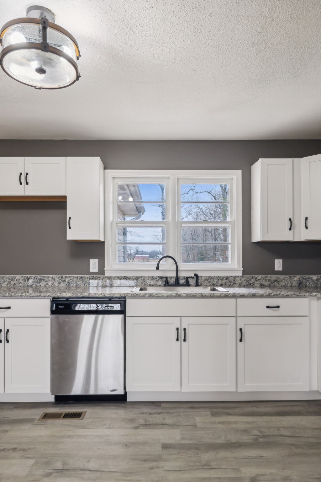 502 Browns Road Lafayette, TN 37083 - Photo 12 of 50 a kitchen with stainless steel appliances granite countertop a stove a sink and a microwave