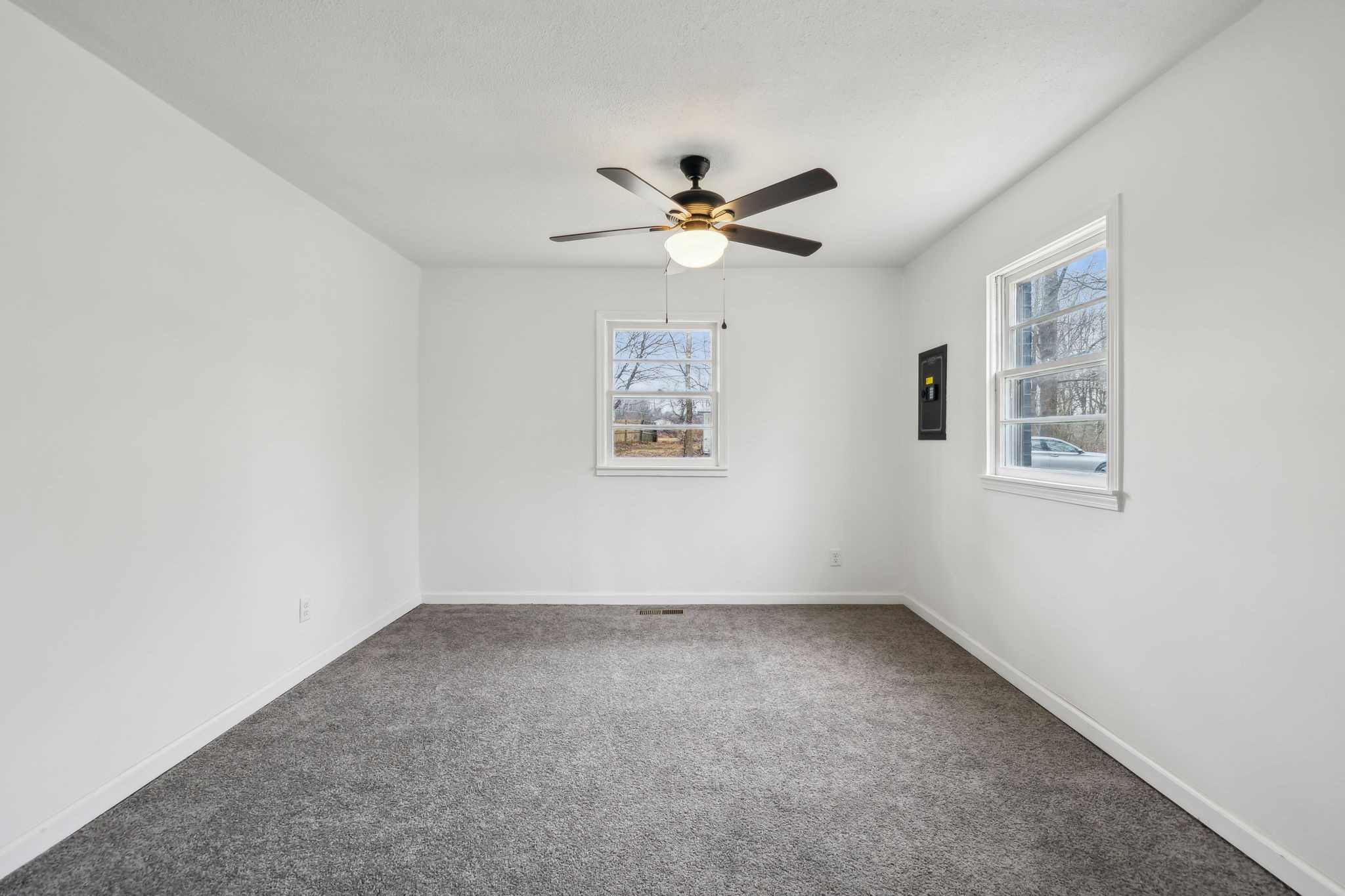 502 Browns Road Lafayette, TN 37083 - Photo 17 of 50 an empty room with a window and a ceiling fan