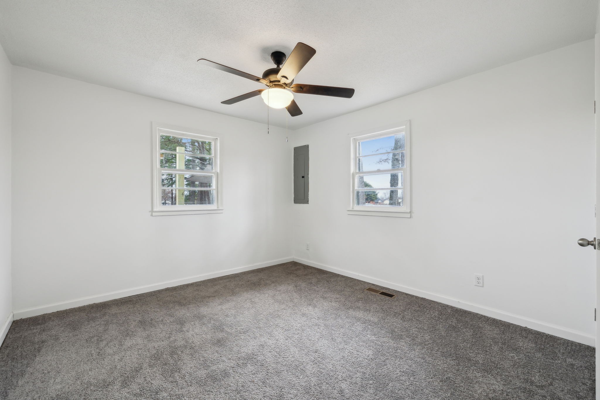 502 Browns Road Lafayette, TN 37083 - Photo 31 of 50 a view of empty room with wooden floor and fan