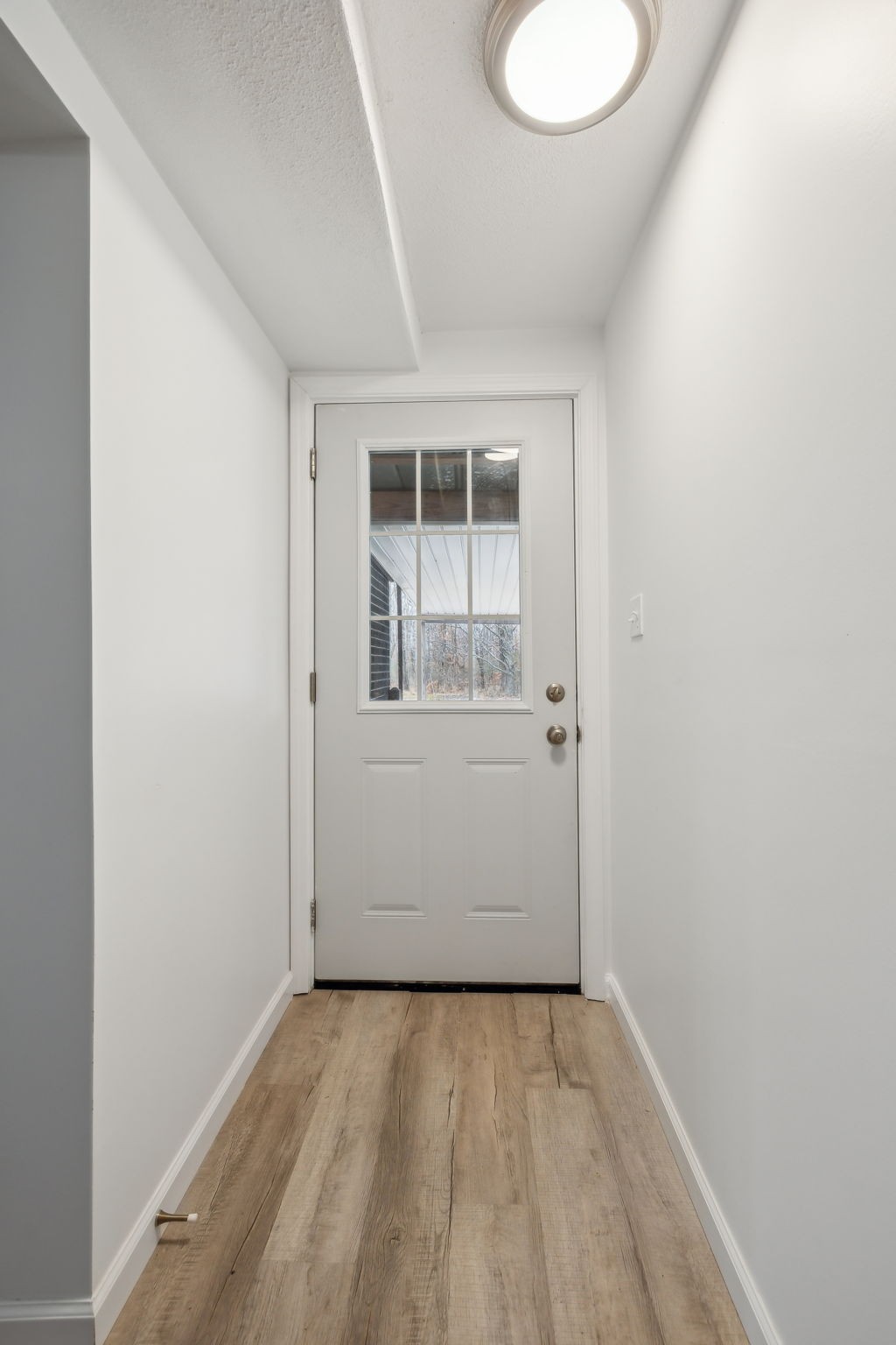 502 Browns Road Lafayette, TN 37083 - Photo 37 of 50 a view of an empty room with wooden floor and a window