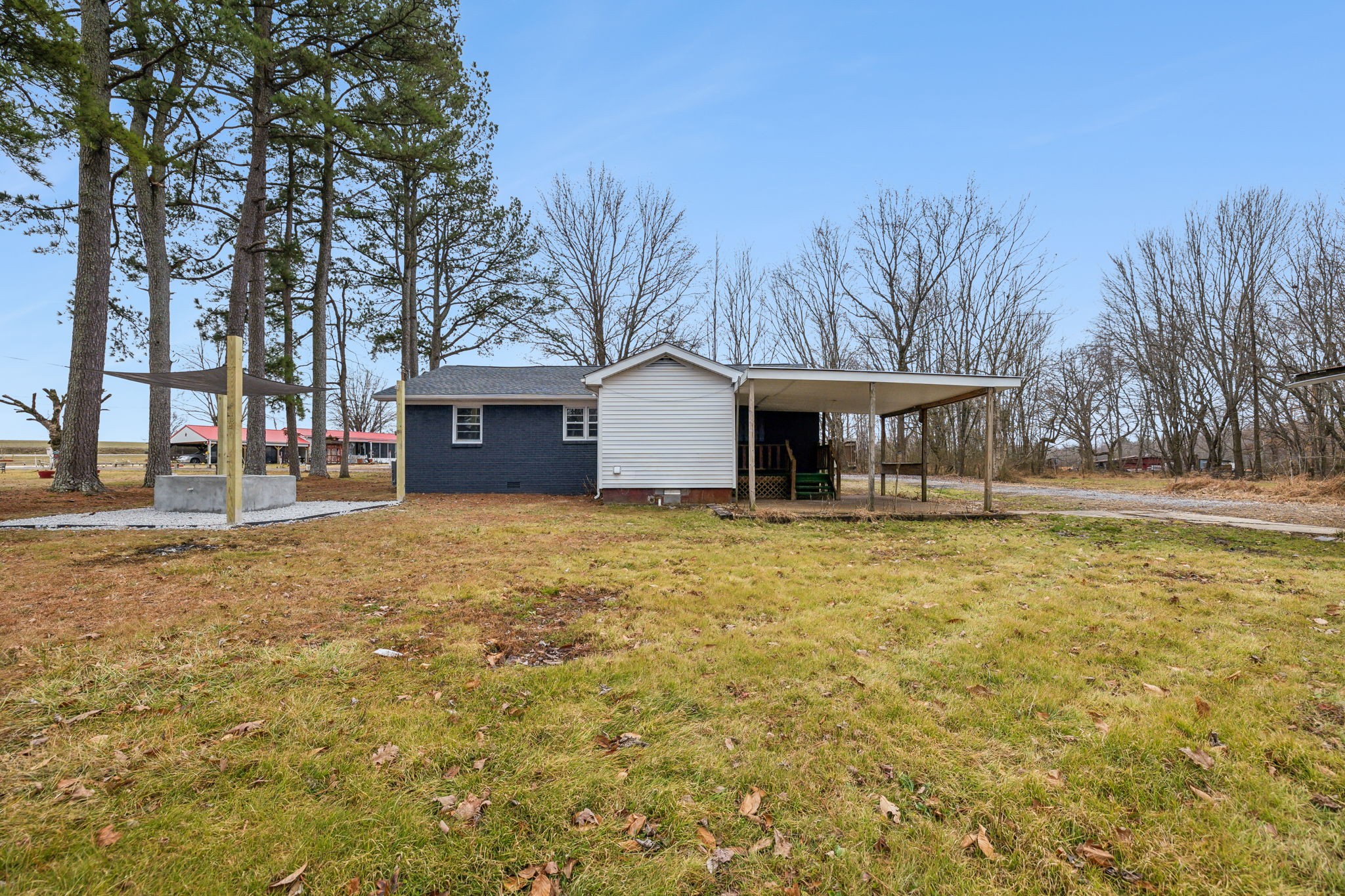 502 Browns Road Lafayette, TN 37083 - Photo 41 of 50 a front view of a house with a garden and tree