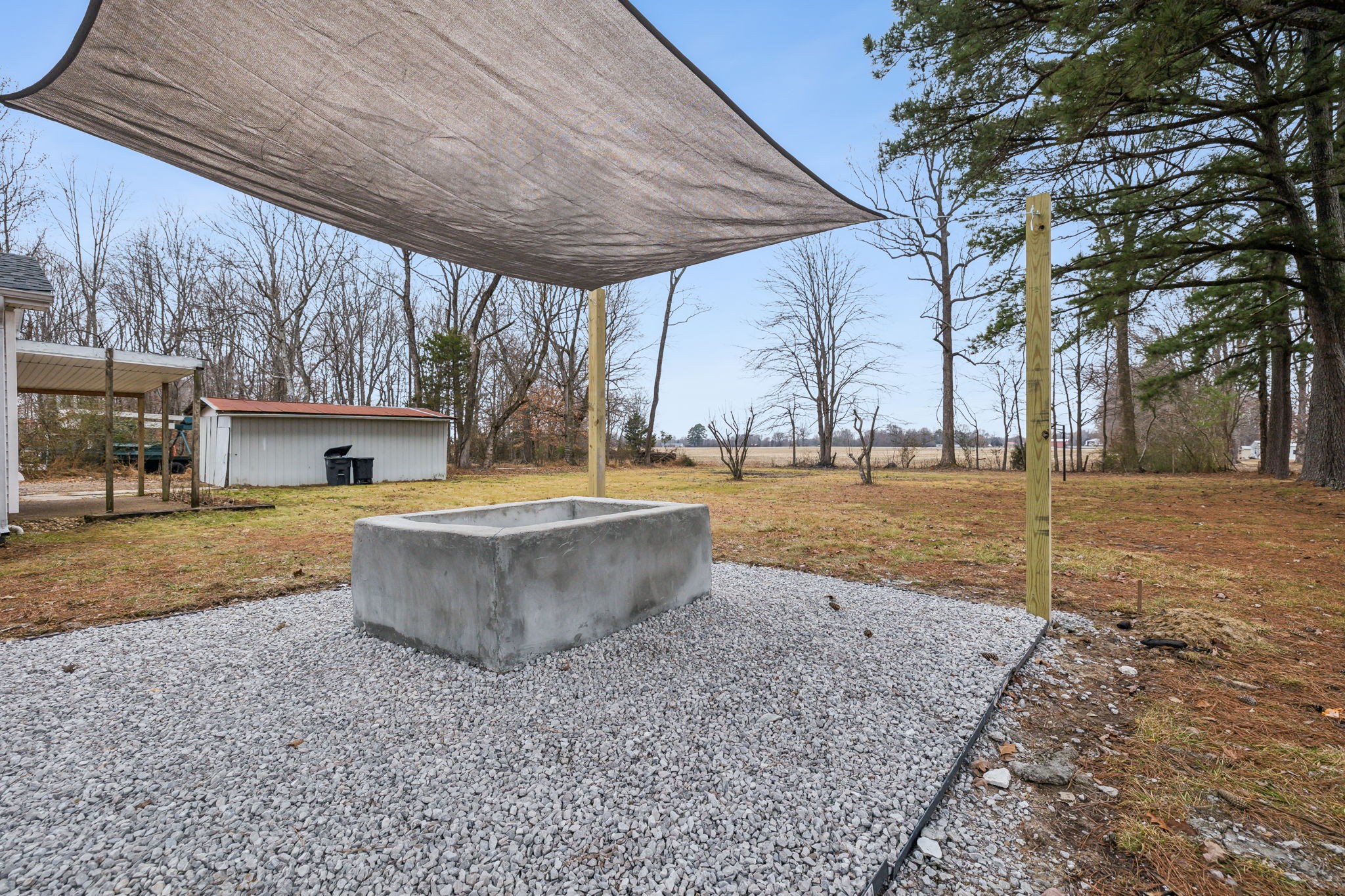 502 Browns Road Lafayette, TN 37083 - Photo 46 of 50 a view of a backyard with fountain plants and large tree