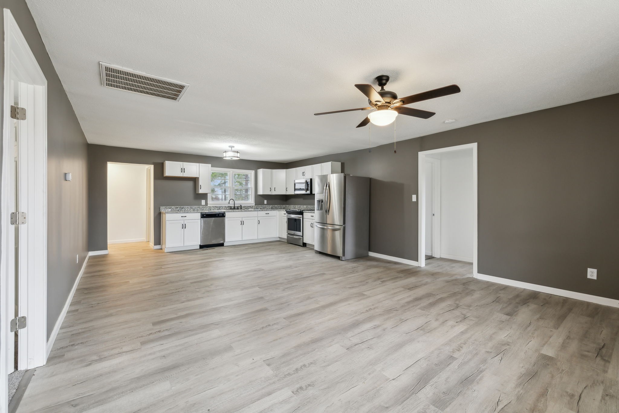 502 Browns Road Lafayette, TN 37083 - Photo 8 of 50 a view of a kitchen with a sink and a refrigerator