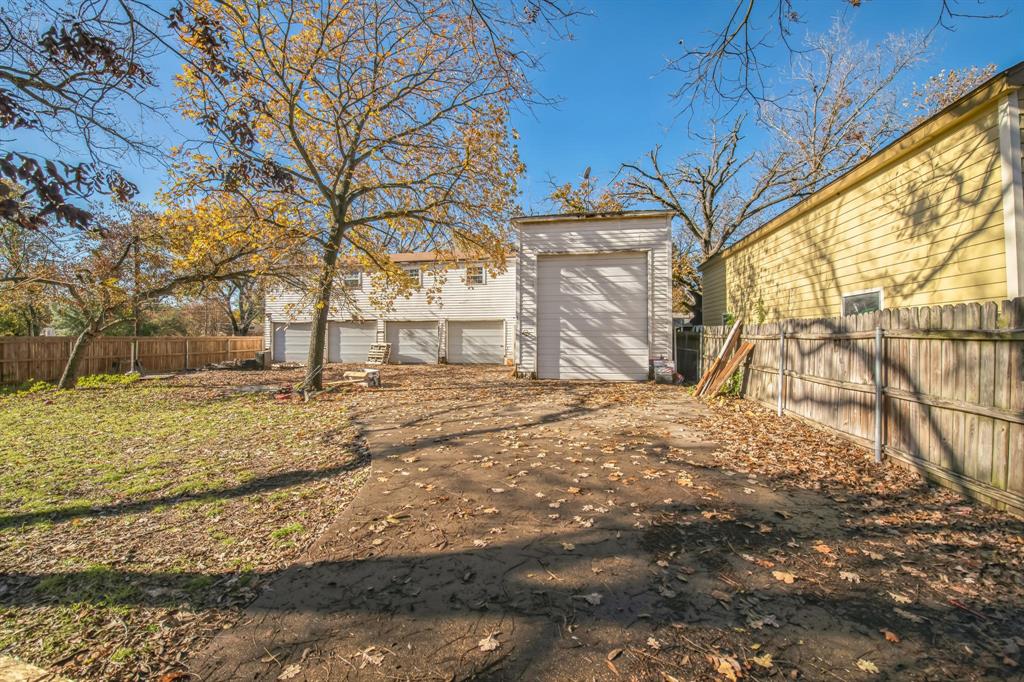 404 Forrest Avenue Cleburne, TX 76033 - Photo 4 of 27 View of yard with a garage and an outdoor structure