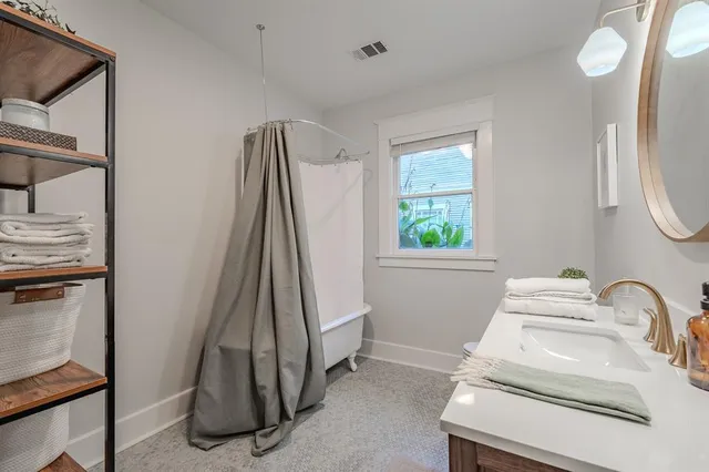 a bathroom with a sink toilet and tub