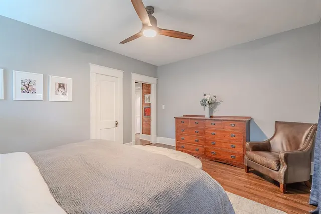 a bedroom with a bed and a couch