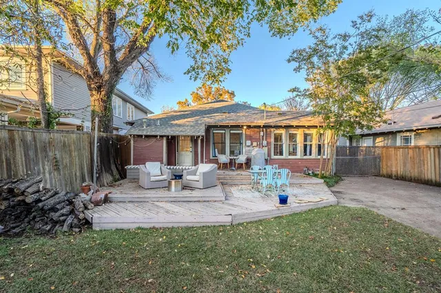 a view of a house with backyard porch and sitting area