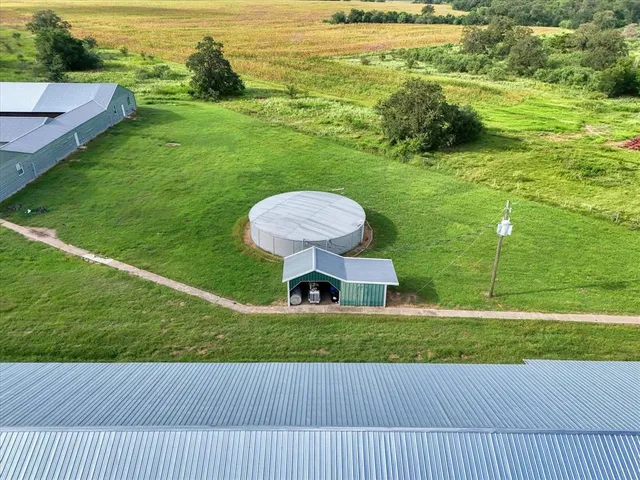 a view of a pool with a yard