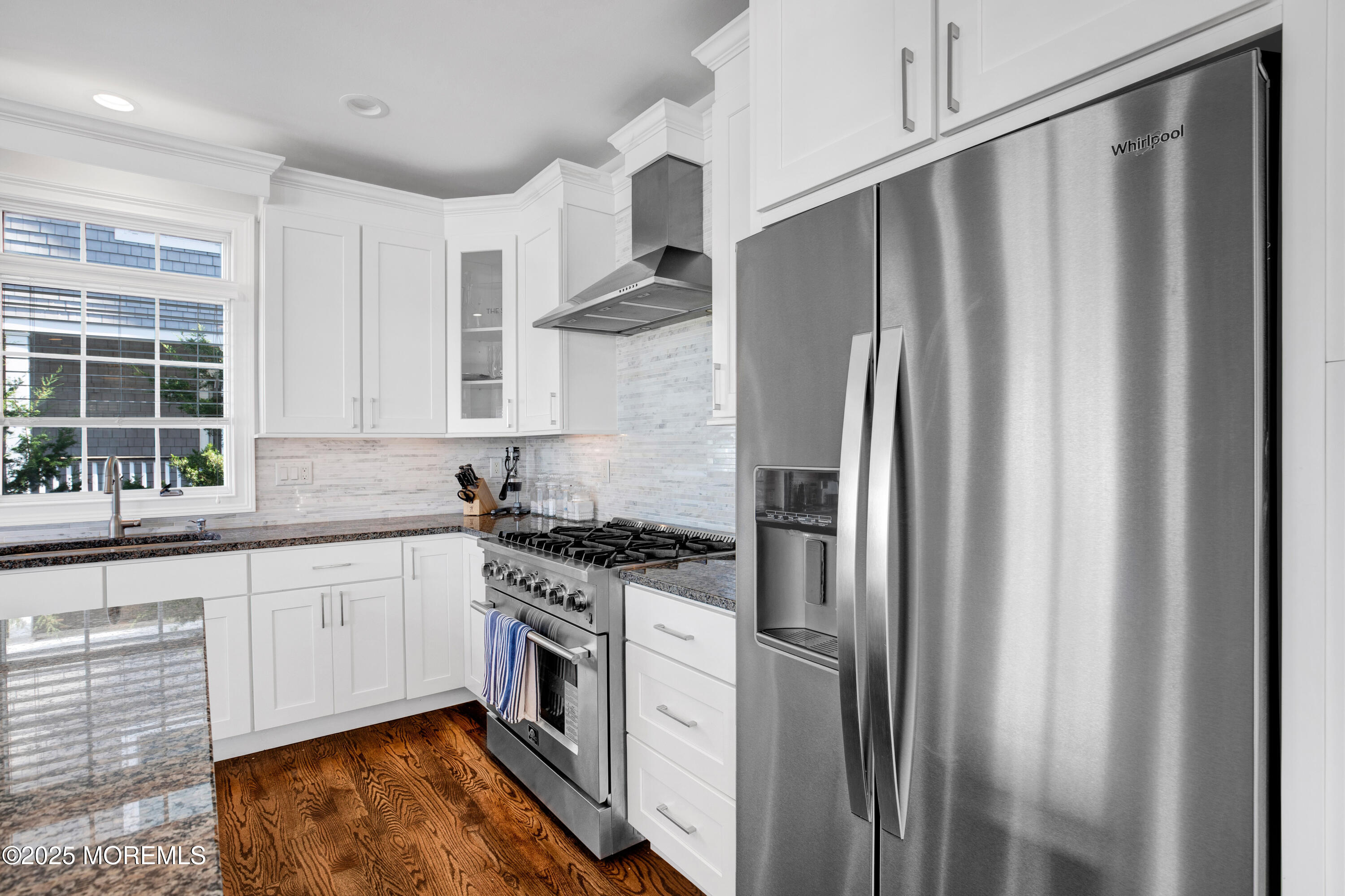 206 North Lagoon Road, Unit SUMMER 2026 Lavallette, NJ 08735 - Photo 12 of 50 a kitchen with stainless steel appliances granite countertop a refrigerator a sink and white cabinets