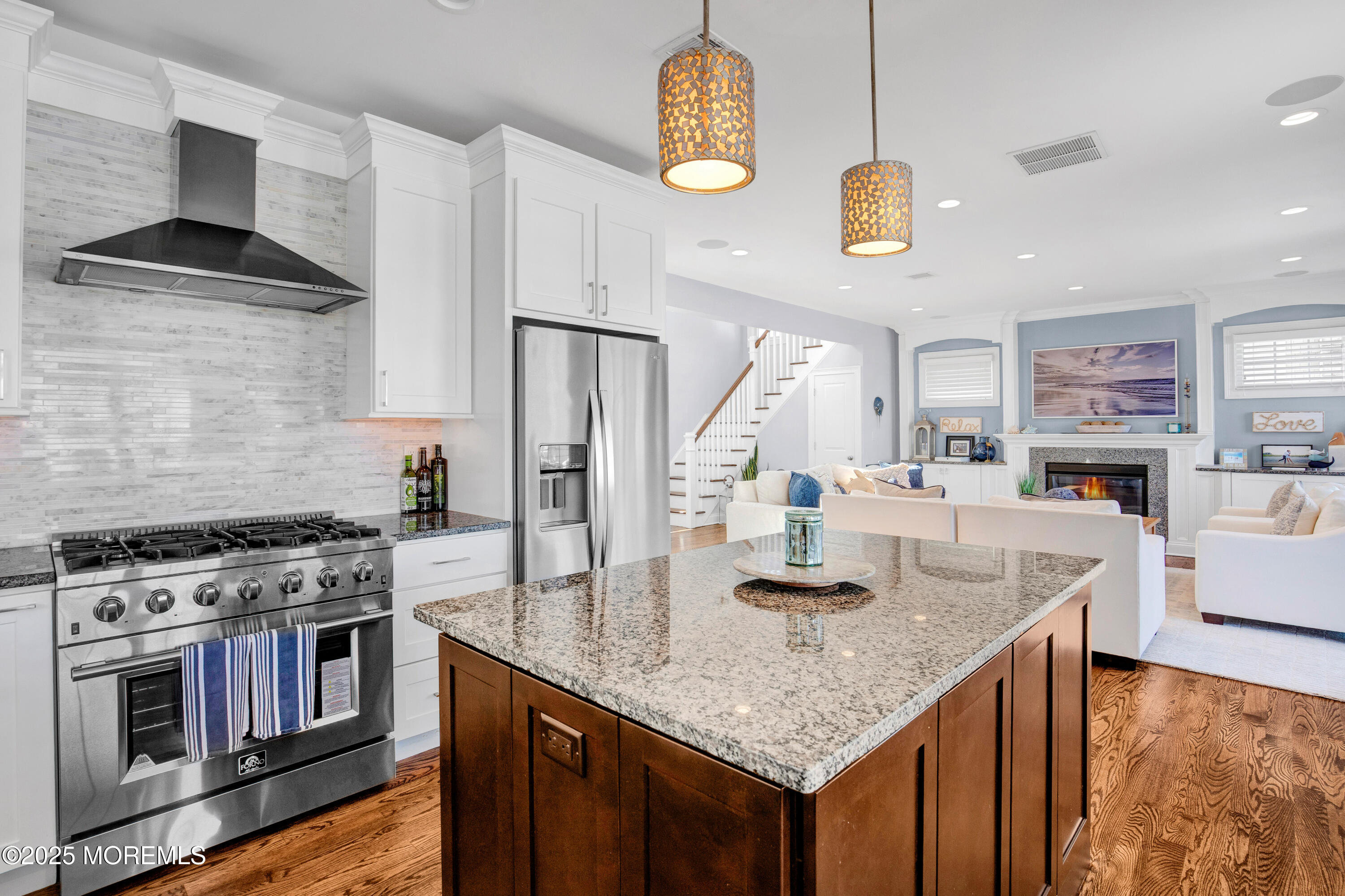 206 North Lagoon Road, Unit SUMMER 2026 Lavallette, NJ 08735 - Photo 14 of 50 a kitchen with stainless steel appliances granite countertop a kitchen island a stove and a sink