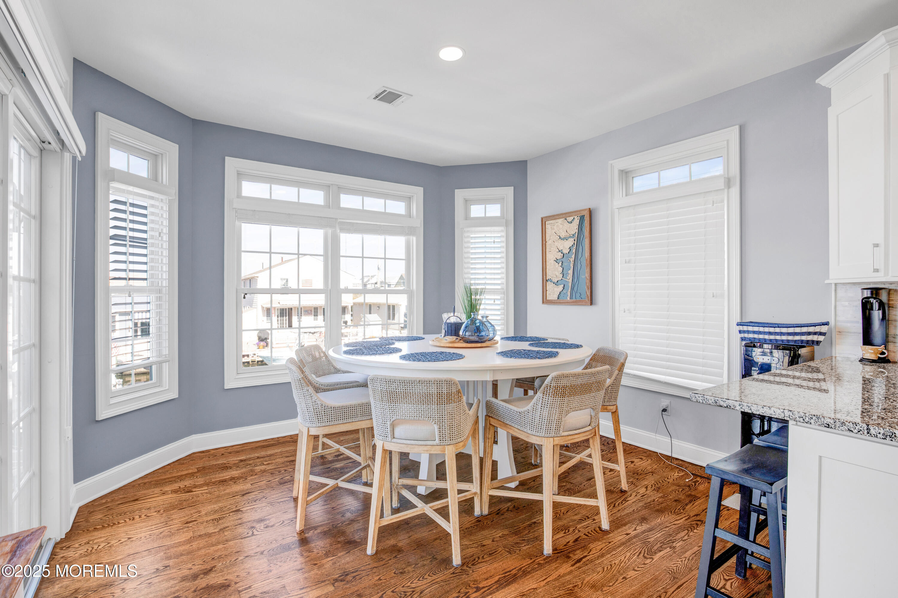 206 North Lagoon Road, Unit SUMMER 2026 Lavallette, NJ 08735 - Photo 15 of 50 a view of a dining room with furniture and wooden floor