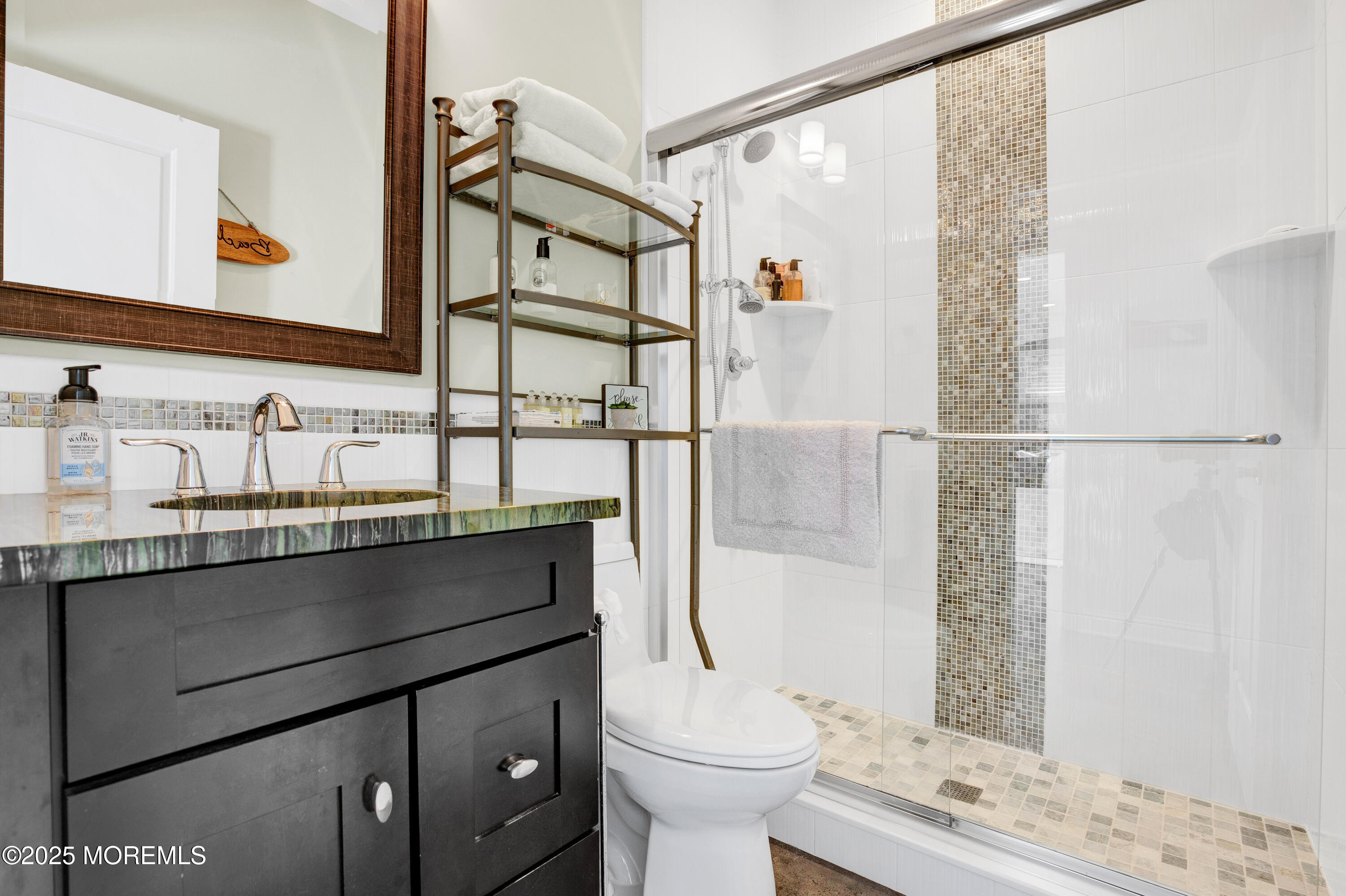 206 North Lagoon Road, Unit SUMMER 2026 Lavallette, NJ 08735 - Photo 18 of 50 a bathroom with a sink toilet and shower