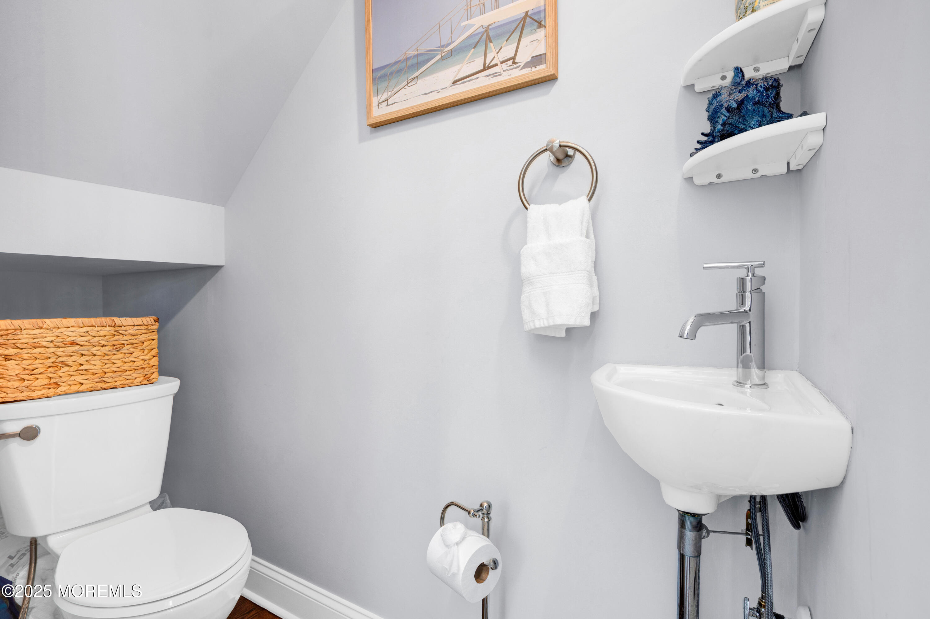 206 North Lagoon Road, Unit SUMMER 2026 Lavallette, NJ 08735 - Photo 19 of 50 a bathroom with a toilet sink and mirror