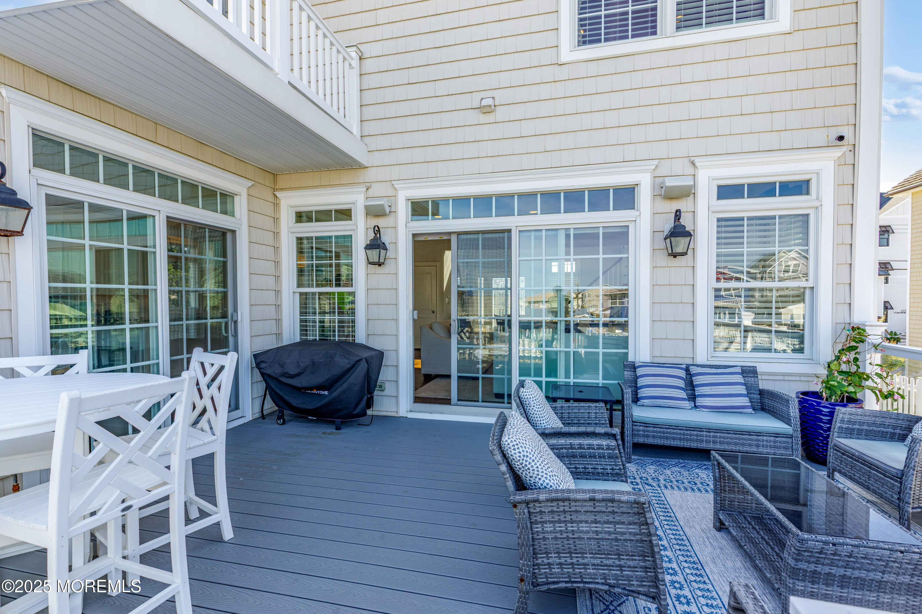 206 North Lagoon Road, Unit SUMMER 2026 Lavallette, NJ 08735 - Photo 20 of 50 a view of a patio with couches