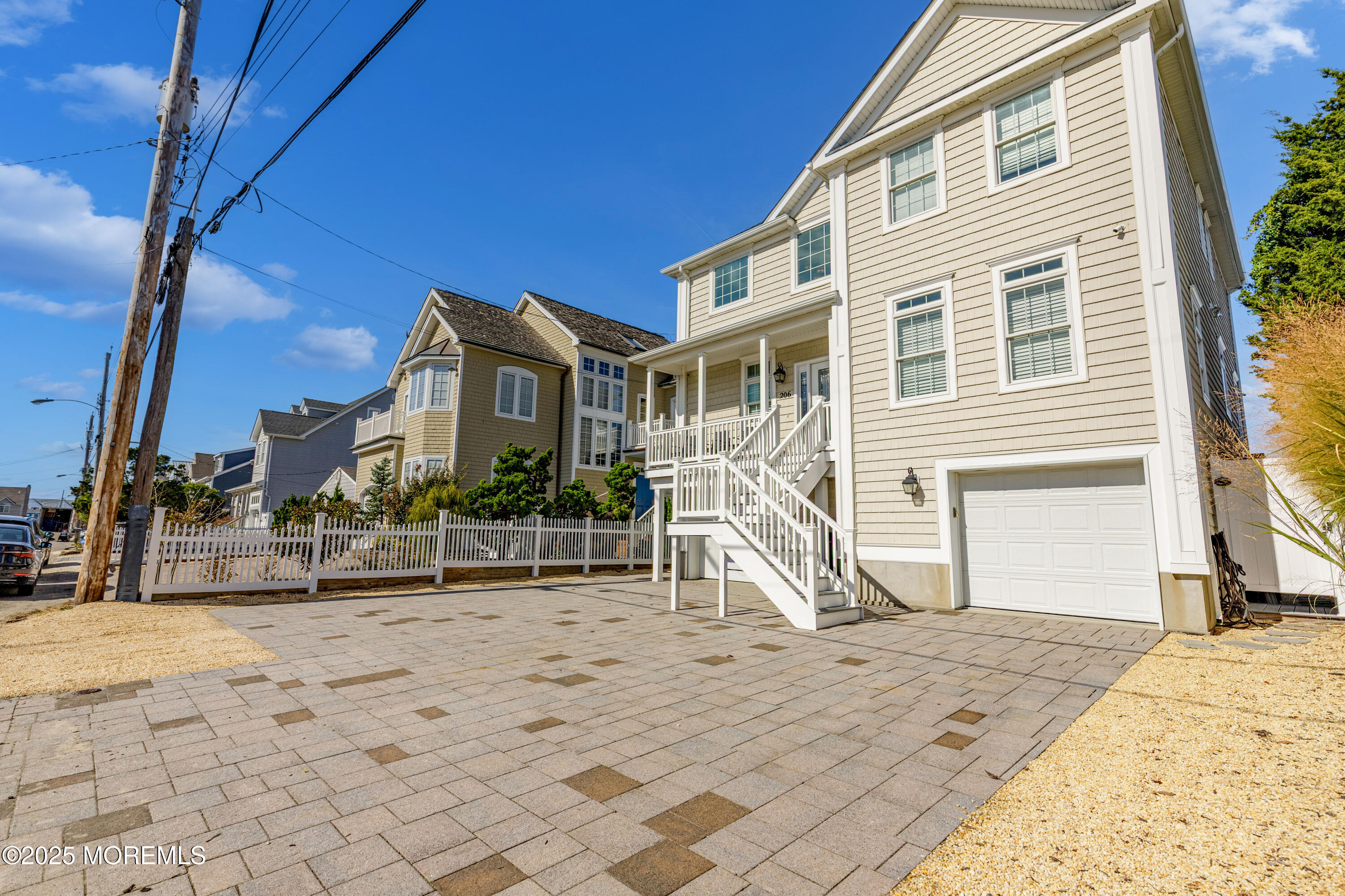 206 North Lagoon Road, Unit SUMMER 2026 Lavallette, NJ 08735 - Photo 2 of 50 a view of a house with wooden fence
