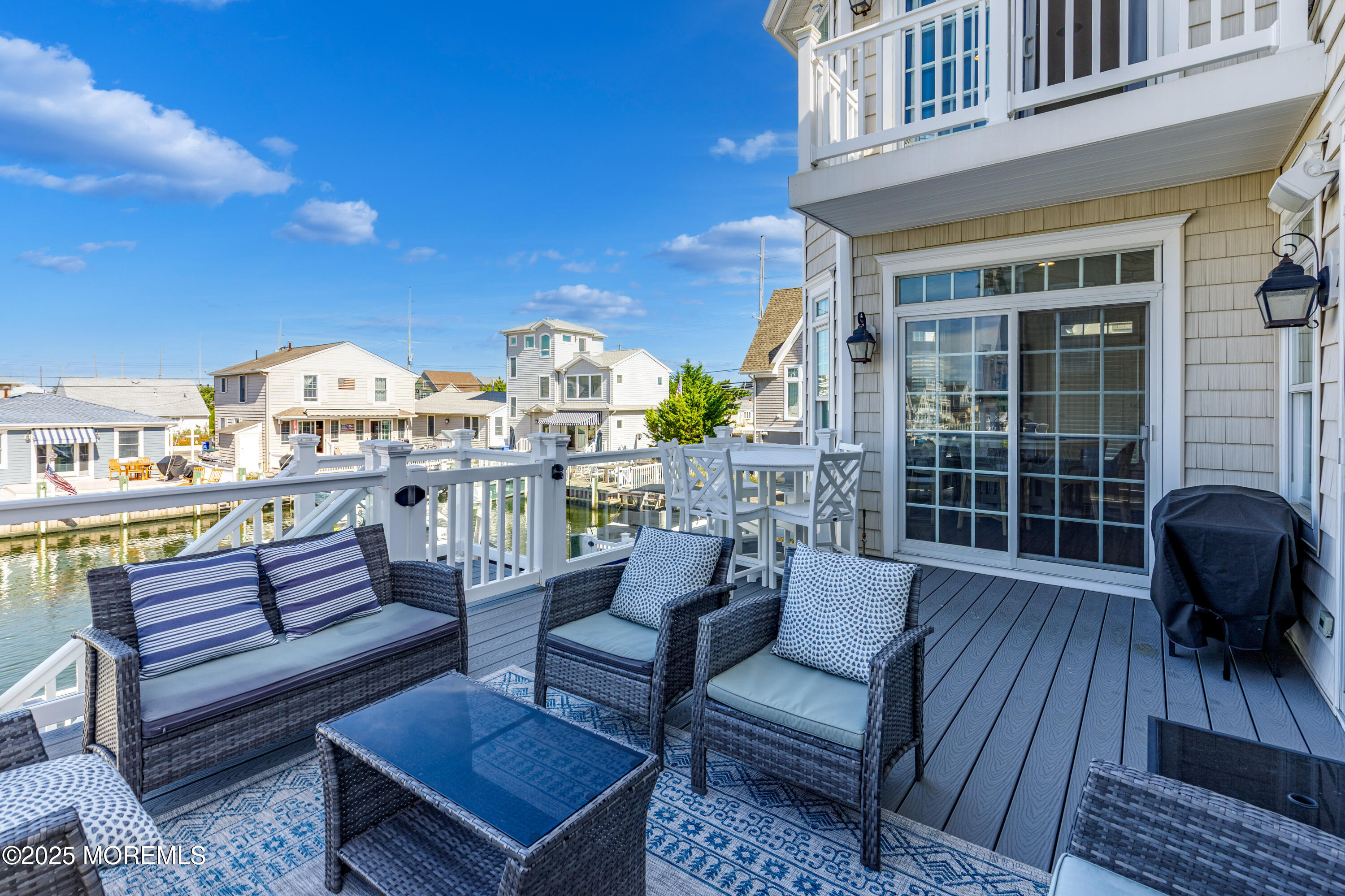 206 North Lagoon Road, Unit SUMMER 2026 Lavallette, NJ 08735 - Photo 21 of 50 a view of a chairs in a patio