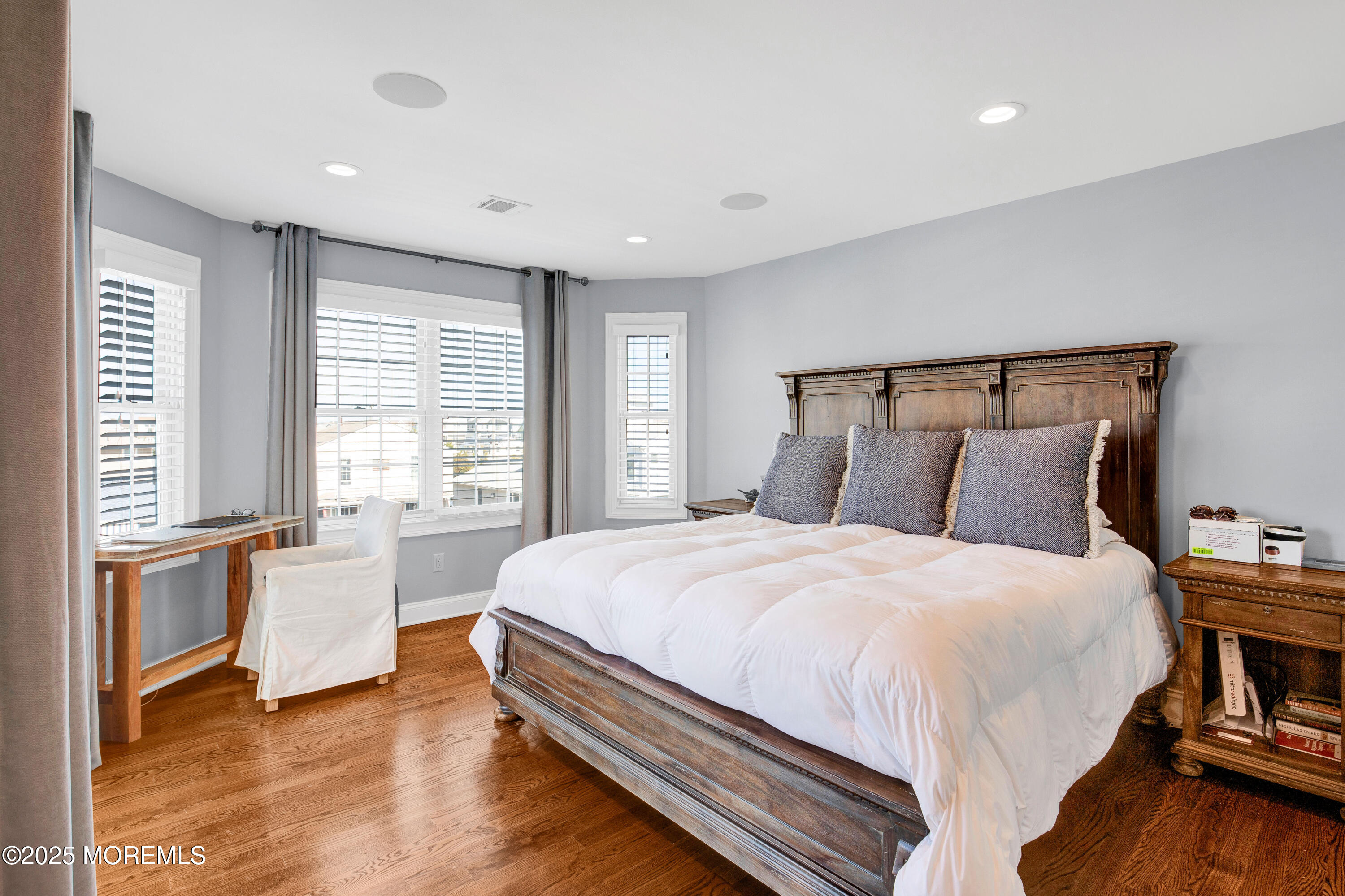 206 North Lagoon Road, Unit SUMMER 2026 Lavallette, NJ 08735 - Photo 34 of 50 a large bed sitting in a bedroom next to a window and a larger closet