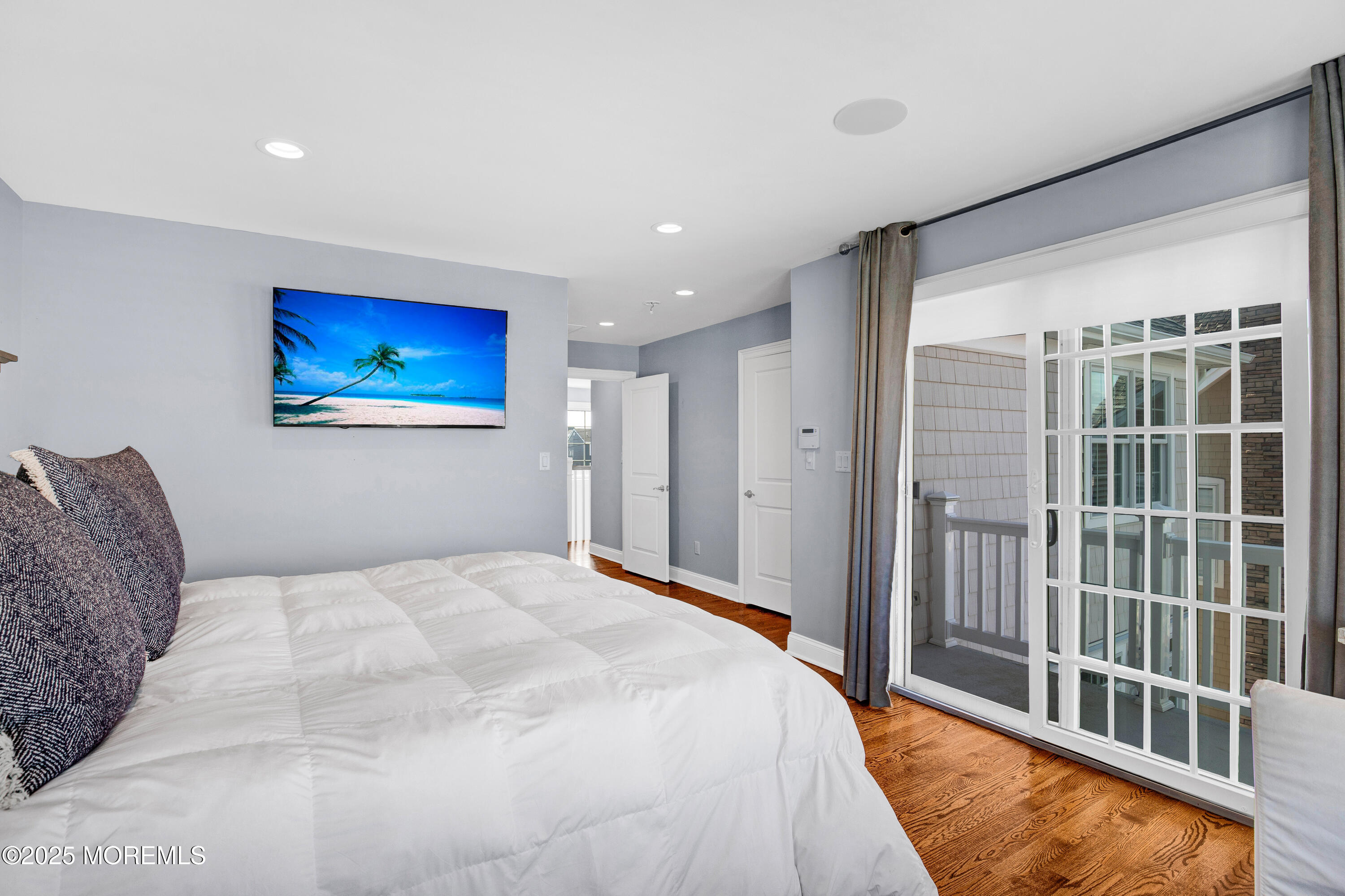 206 North Lagoon Road, Unit SUMMER 2026 Lavallette, NJ 08735 - Photo 35 of 50 a bedroom with a large bed and a window