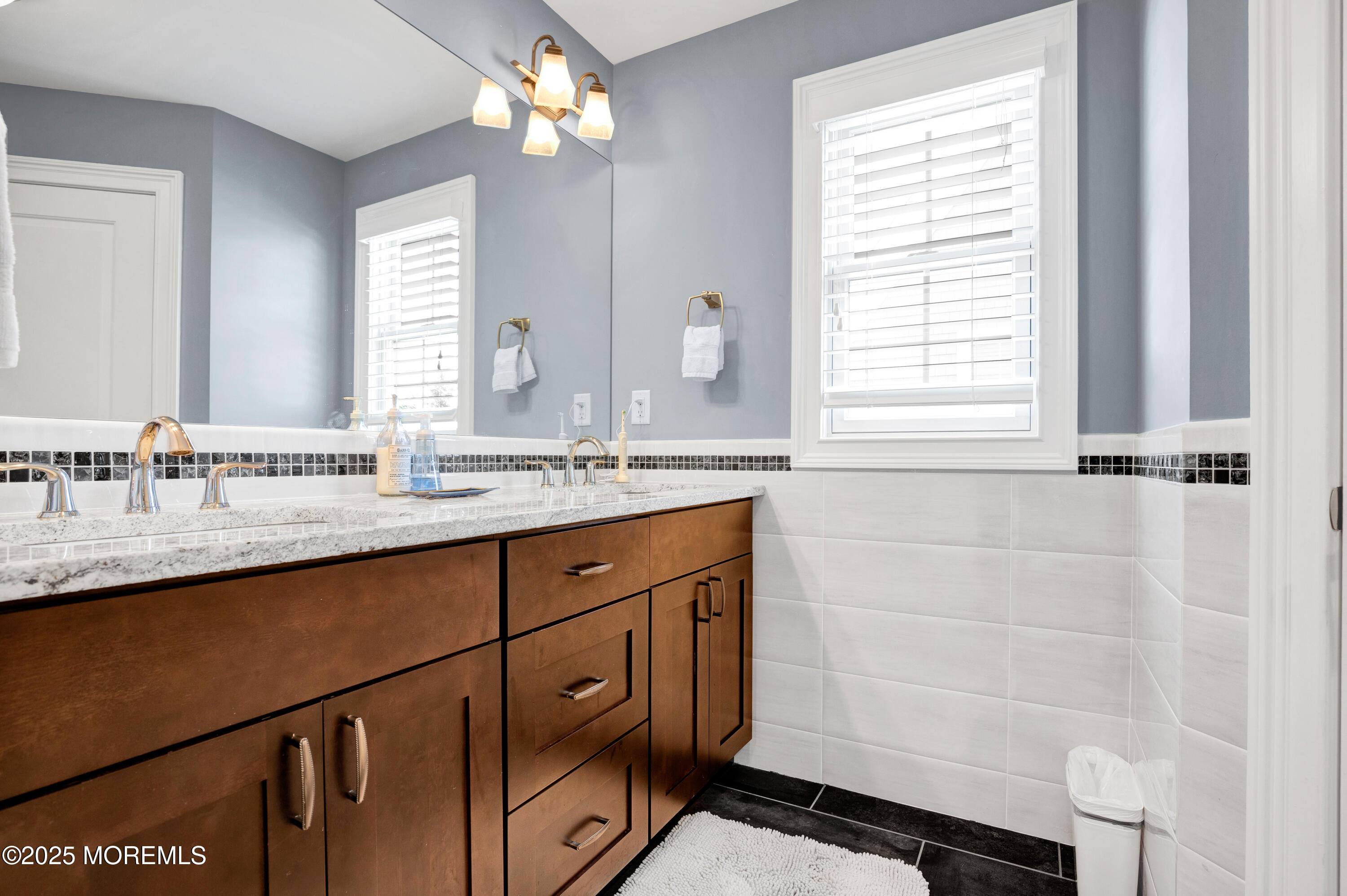 206 North Lagoon Road, Unit SUMMER 2026 Lavallette, NJ 08735 - Photo 36 of 50 a bathroom with a sink and a mirror