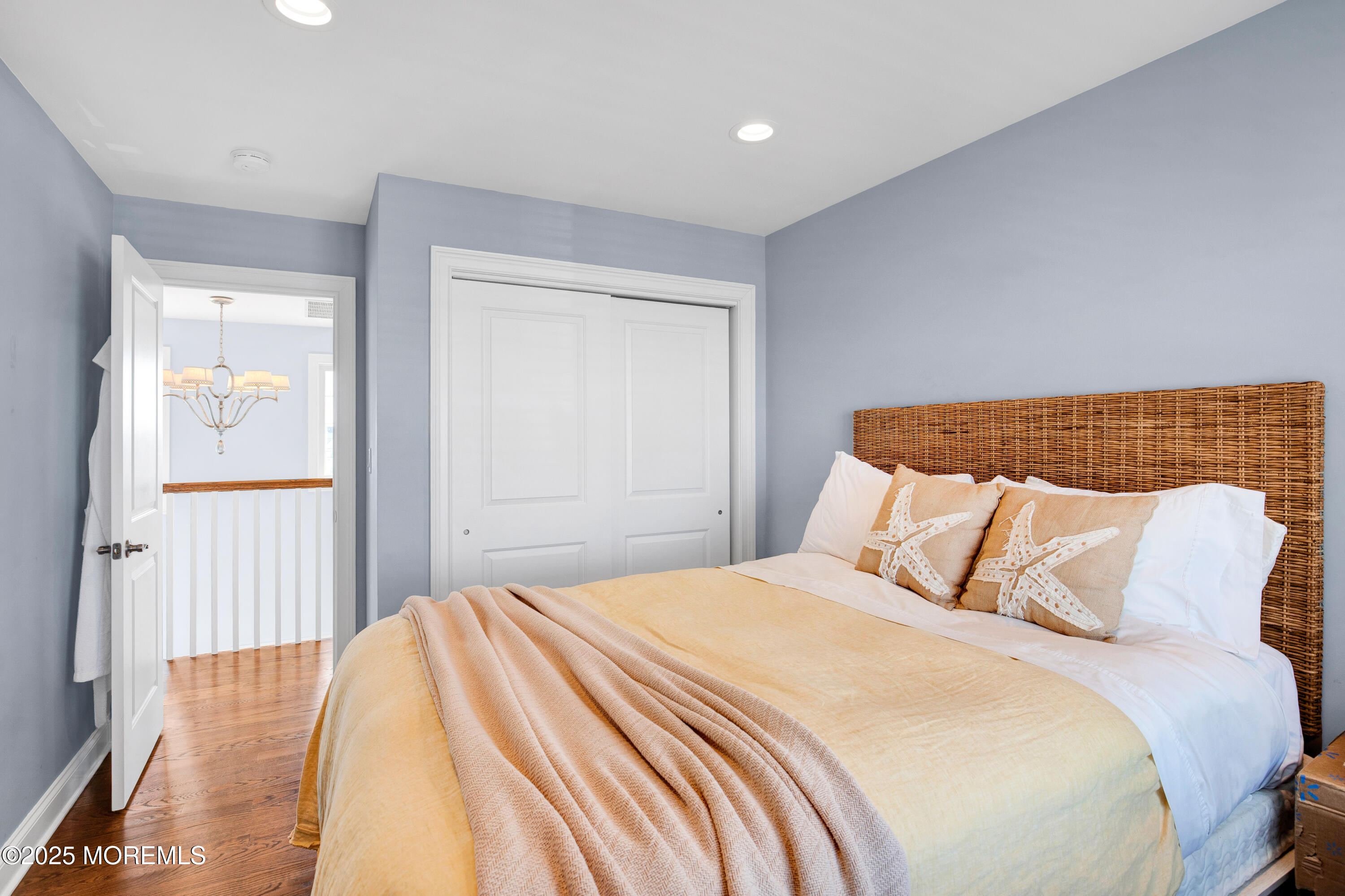 206 North Lagoon Road, Unit SUMMER 2026 Lavallette, NJ 08735 - Photo 40 of 50 a bedroom with a bed and wooden floor