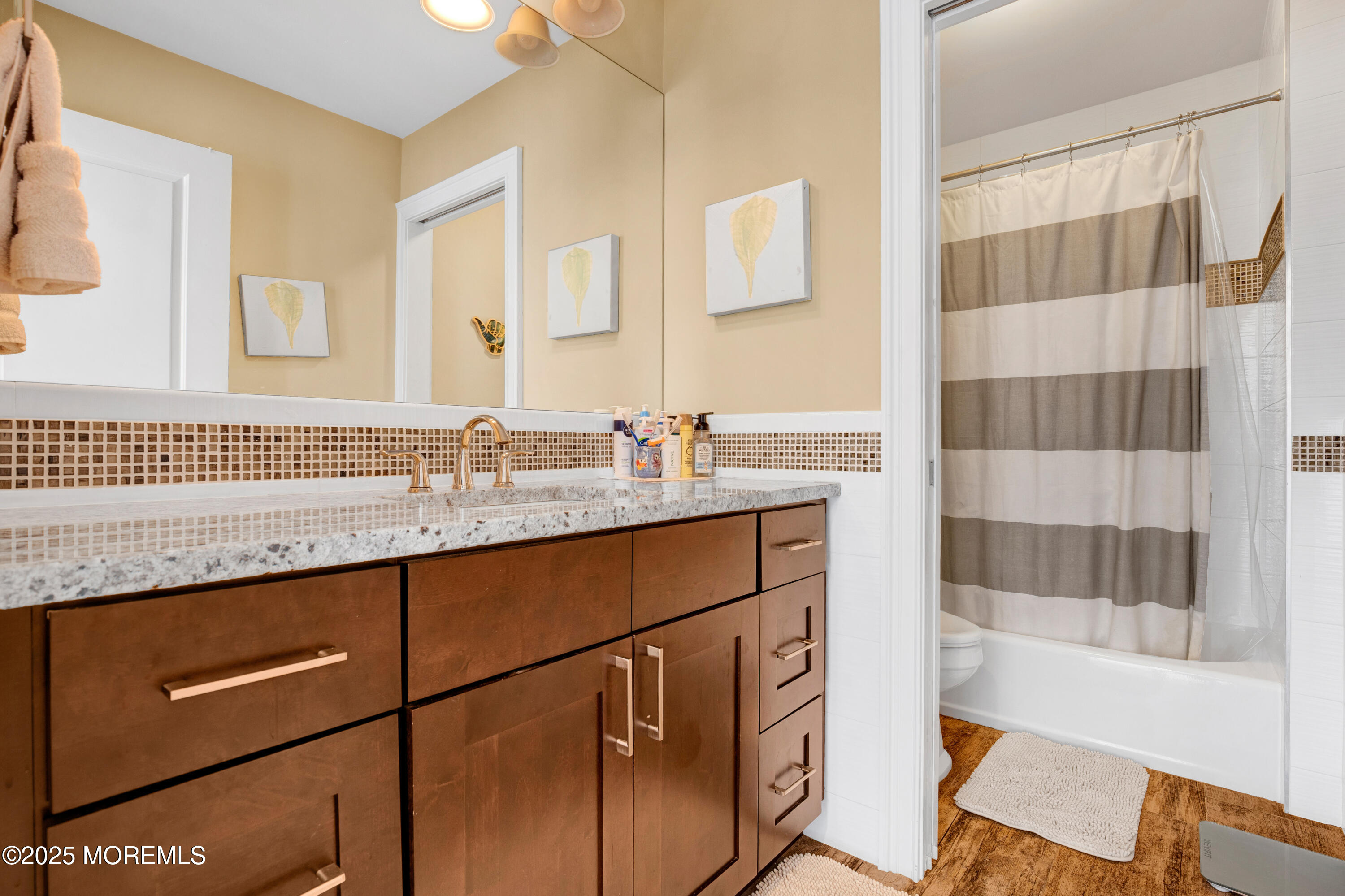 206 North Lagoon Road, Unit SUMMER 2026 Lavallette, NJ 08735 - Photo 43 of 50 a bathroom with a sink and a mirror