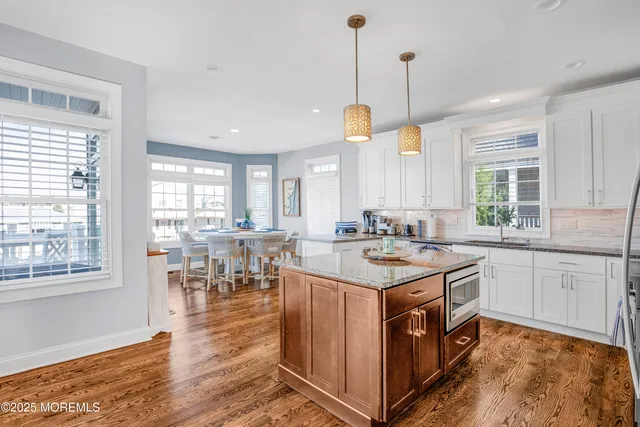 a kitchen with a sink stove and wooden cabinets