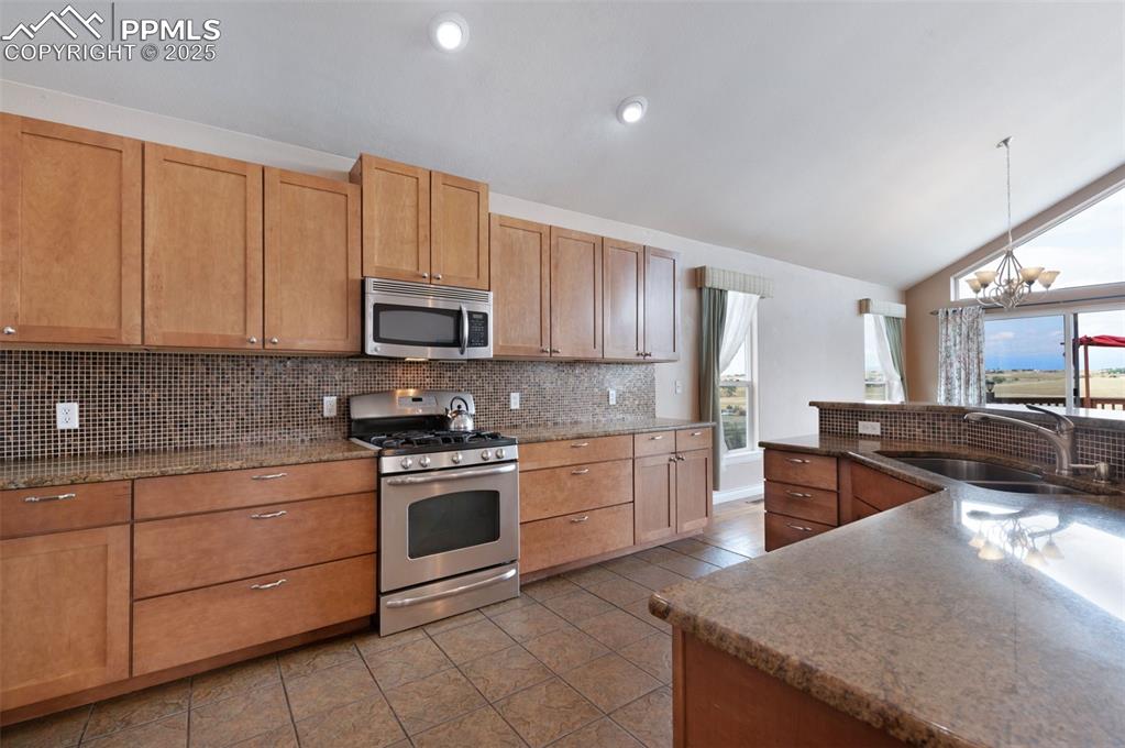 3730 Curtis Road Peyton, CO 80831 - Photo 4 of 50 42" Uppers In This Expansive Kitchen