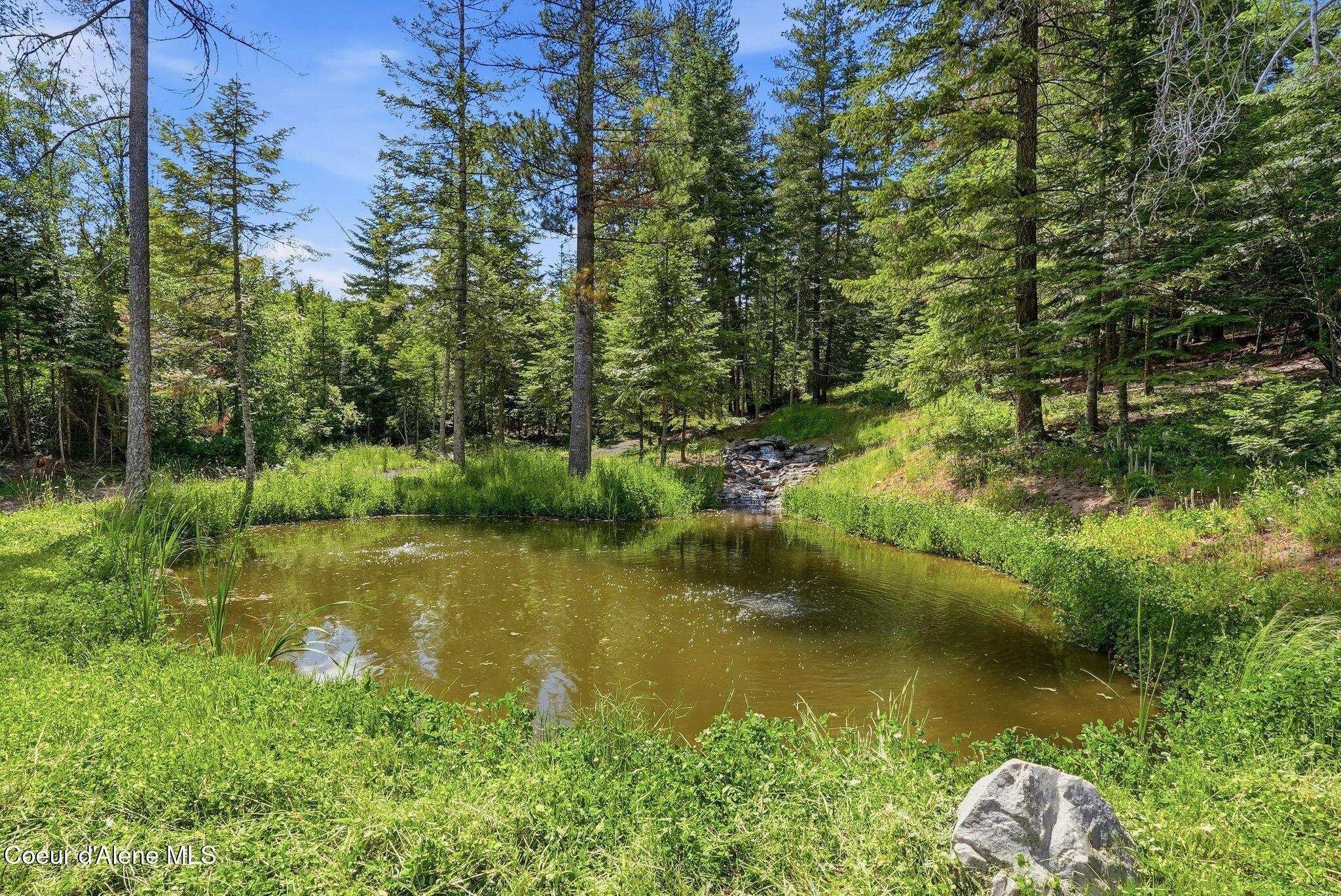 10439 West Cougar Gulch Road Coeur D'Alene, ID 83814 - Photo 15 of 128 The Waterfall & Pond at Cougar Pines