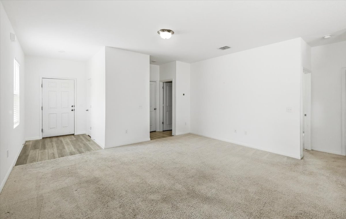 202 Peridot Pass Maxwell, TX 78656 - Photo 4 of 21 A spacious, open concept living area awaits, featuring a neutral palette and natural light.