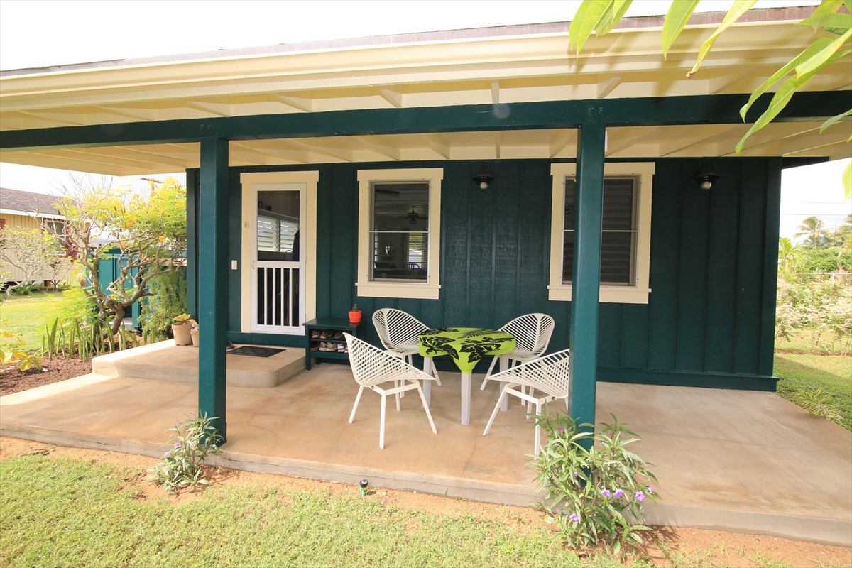 1004 Kealoha Road Kapaa, HI 96746 - Photo 3 of 8 a view of a patio with table and chairs and potted plants
