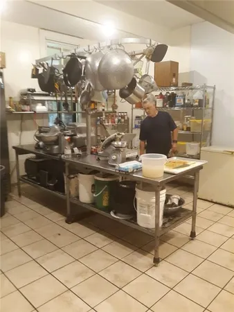 a view of a refrigerator in kitchen