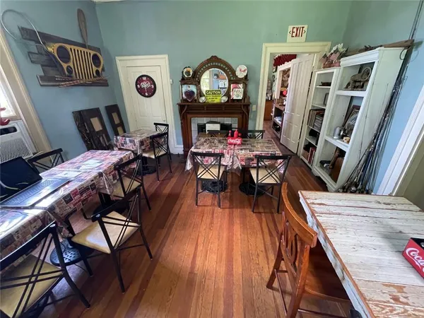 a view of a dining room with furniture window and wooden floor