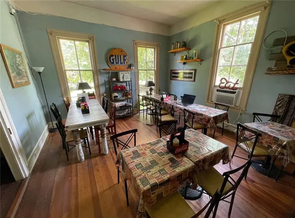 a view of a dining room with furniture and chandelier