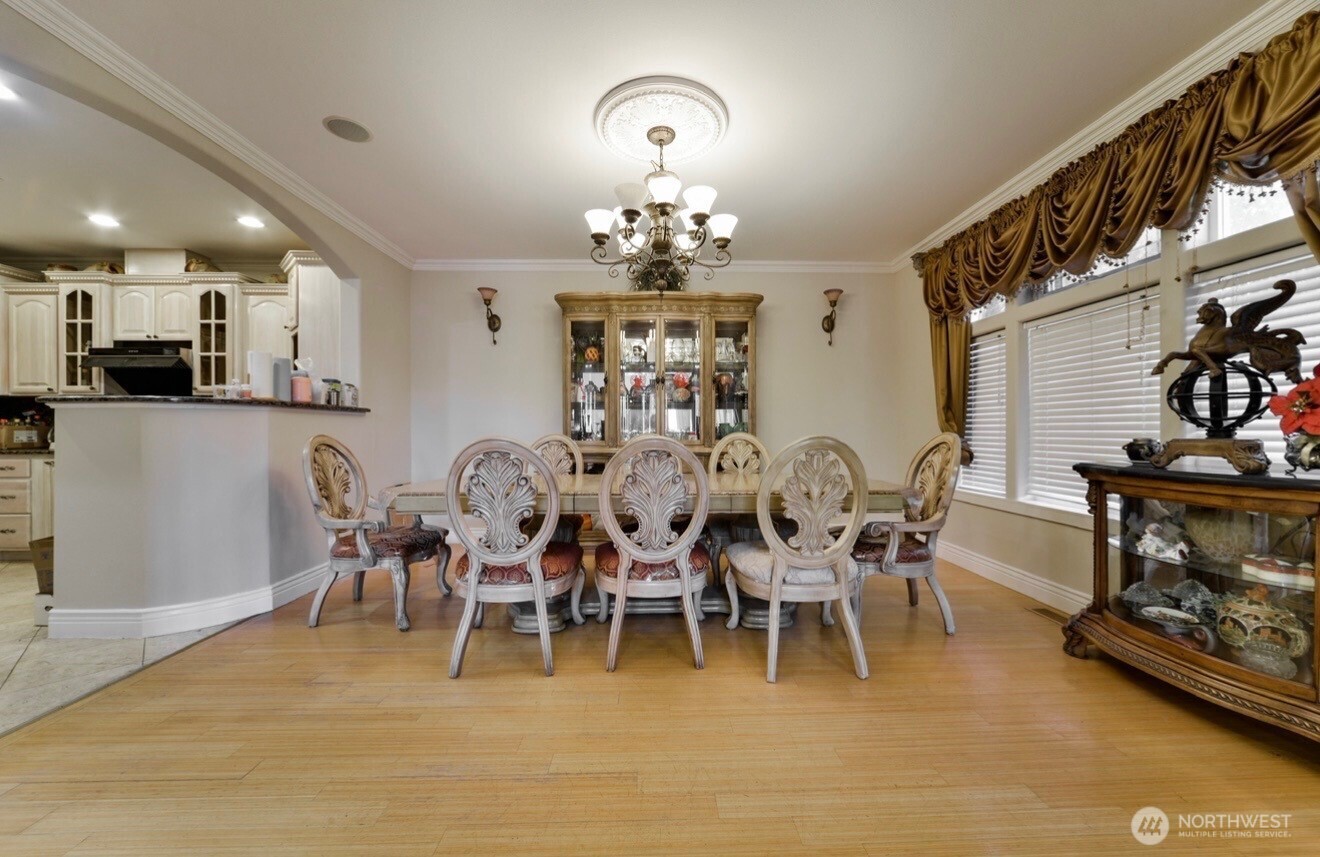 0 124th Kirkland, WA 98034 - Photo 6 of 10 a view of a dining room with furniture and chandelier