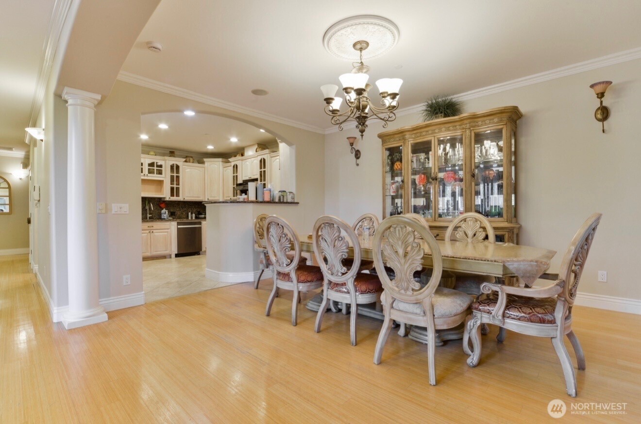0 124th Kirkland, WA 98034 - Photo 8 of 10 a view of a dining room with furniture and chandelier