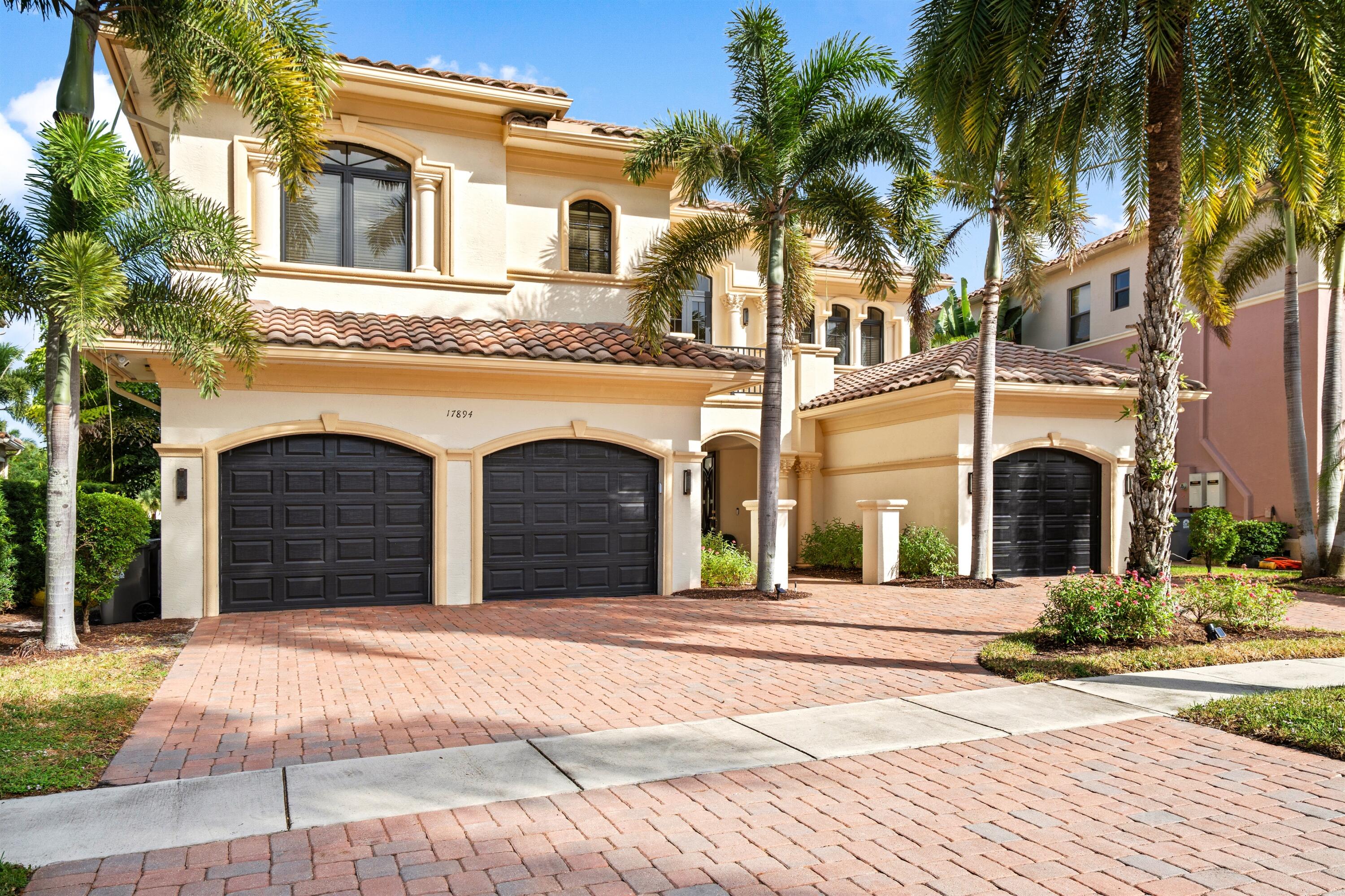 17894 Monte Vista Drive Boca Raton, FL 33496 - Photo 1 of 47 a view of a white house with a outdoor space