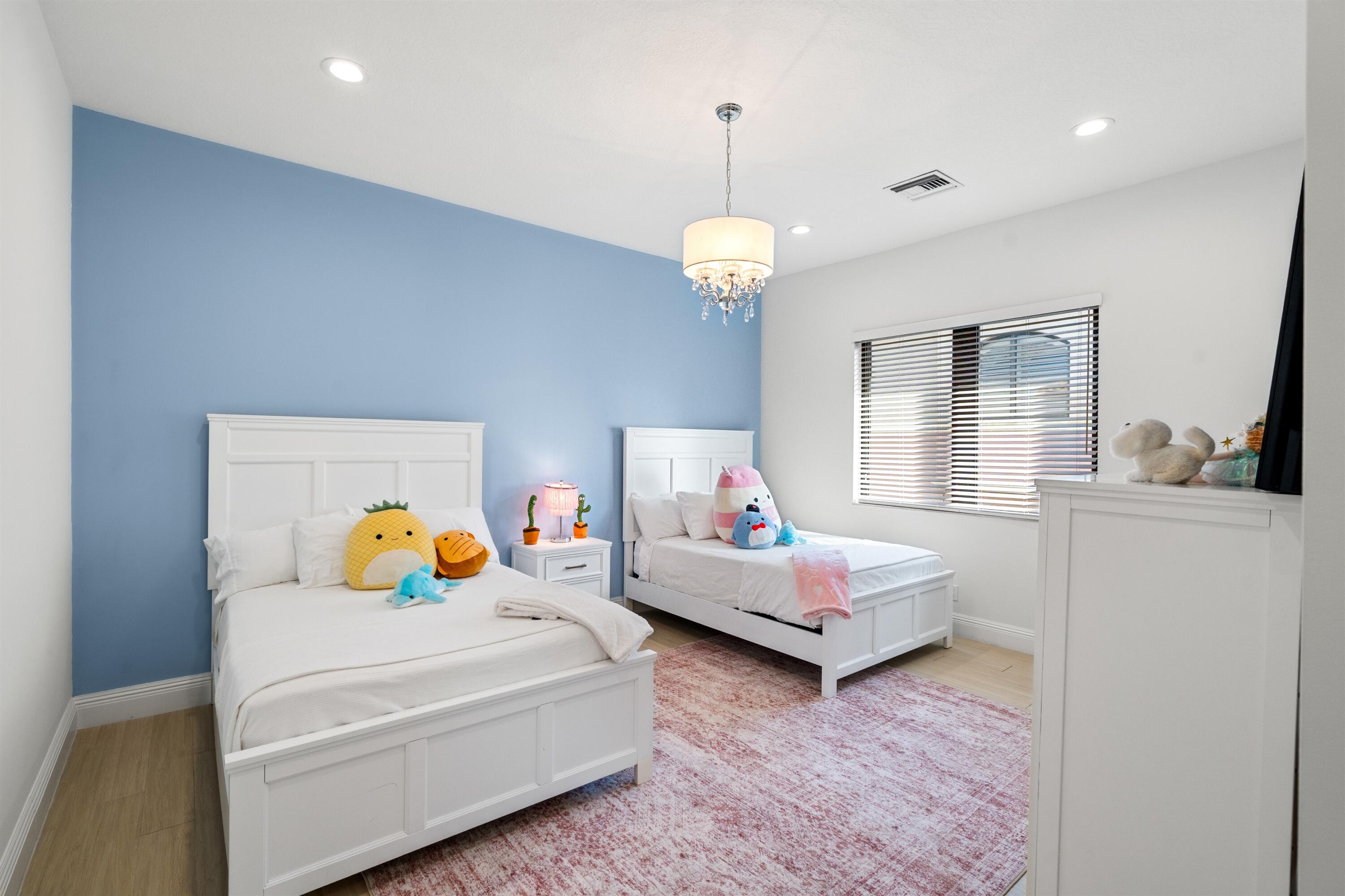 17894 Monte Vista Drive Boca Raton, FL 33496 - Photo 18 of 47 a bedroom with bed and window